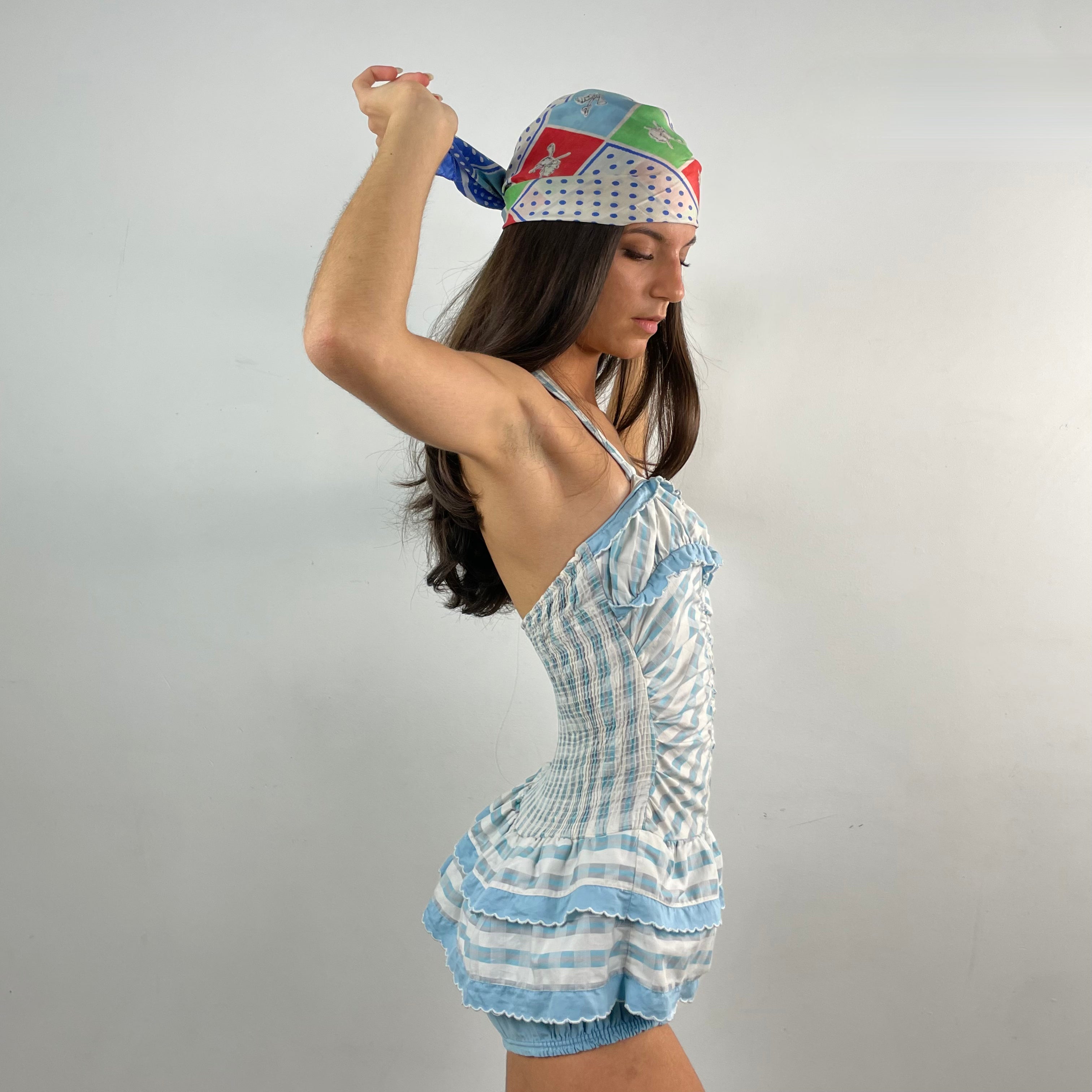 Boheme Vintage 1950s–1960s Sea Nymph Glamour Suit by Milbro cotton one-piece bathing suit with halter neckline, ruffled skirt, and built-in shorts.
