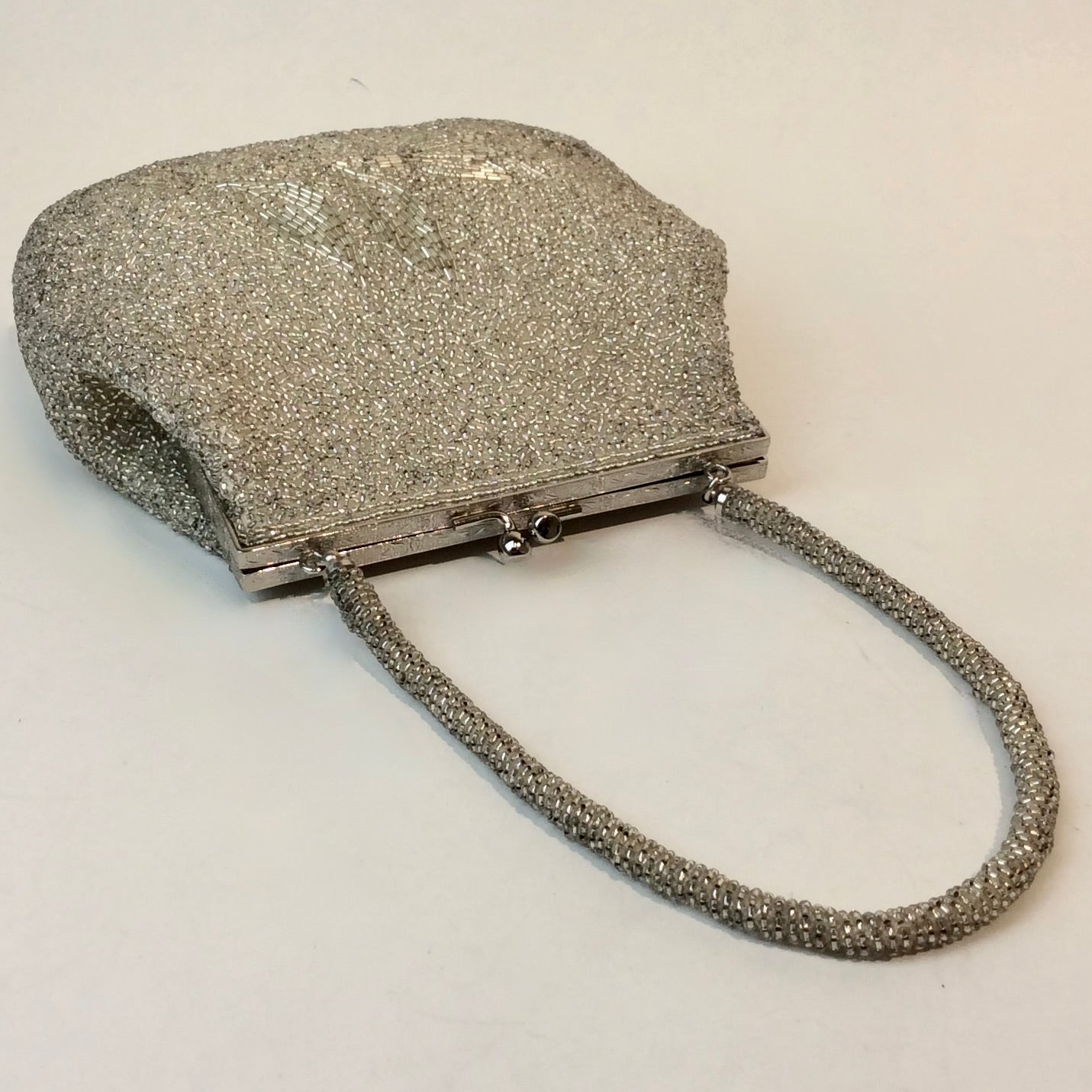 Boheme Vintage 1950s silver beaded evening handbag with floral beadwork, kiss‑lock closure, and beaded strap.