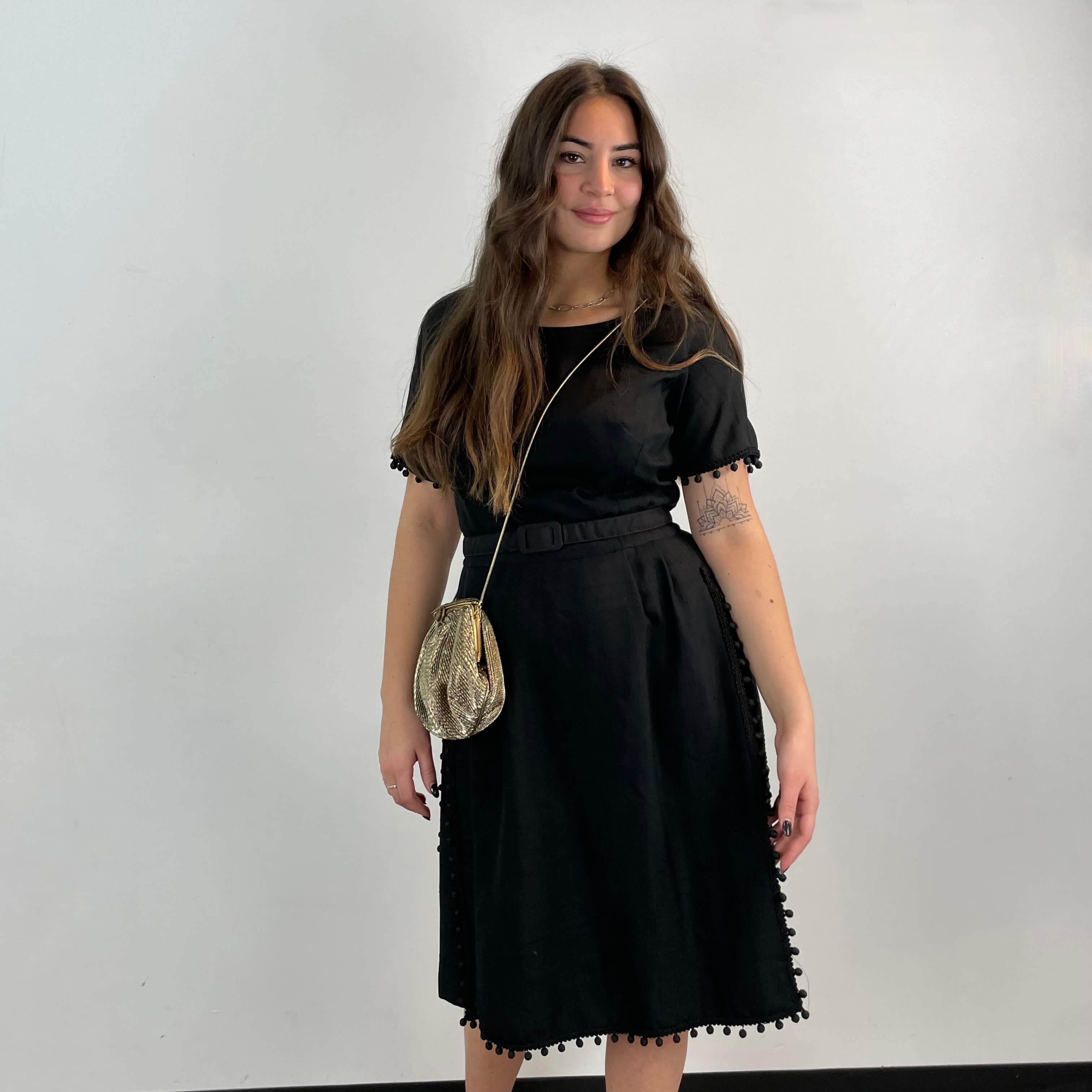 Front view of 1950s Black Short-Sleeve Cocktail Dress size medium sold at bohemevintage.com Montreal