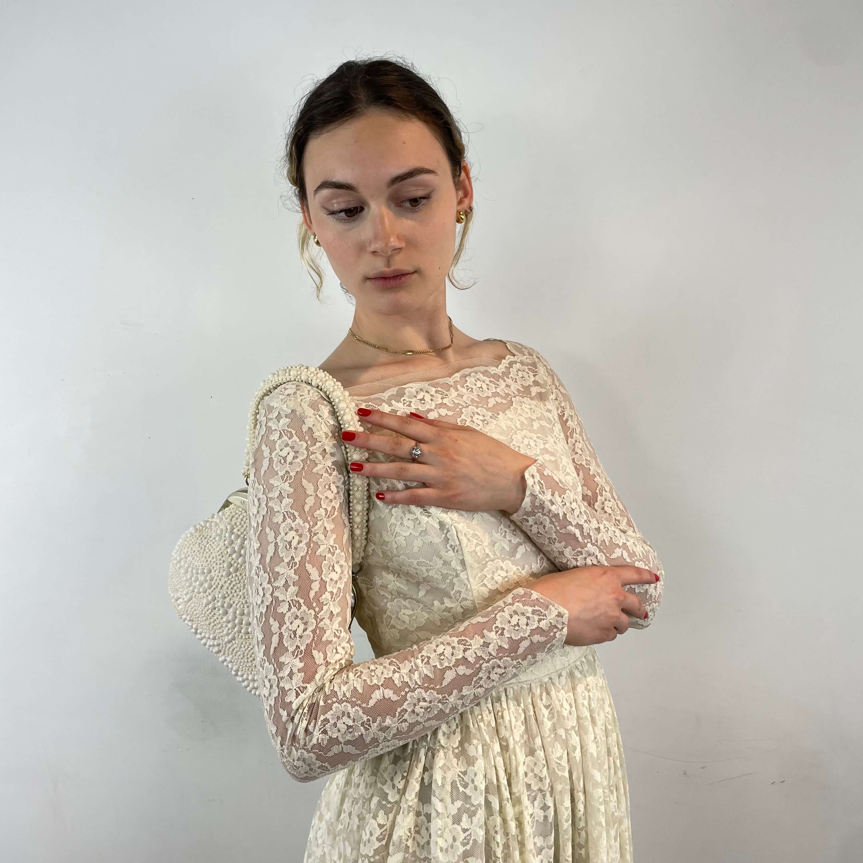 Front view of 1950s Ivory Long Sleeve Lace Dress size Extra-Small/Small sold at bohemevintage.com Montreal