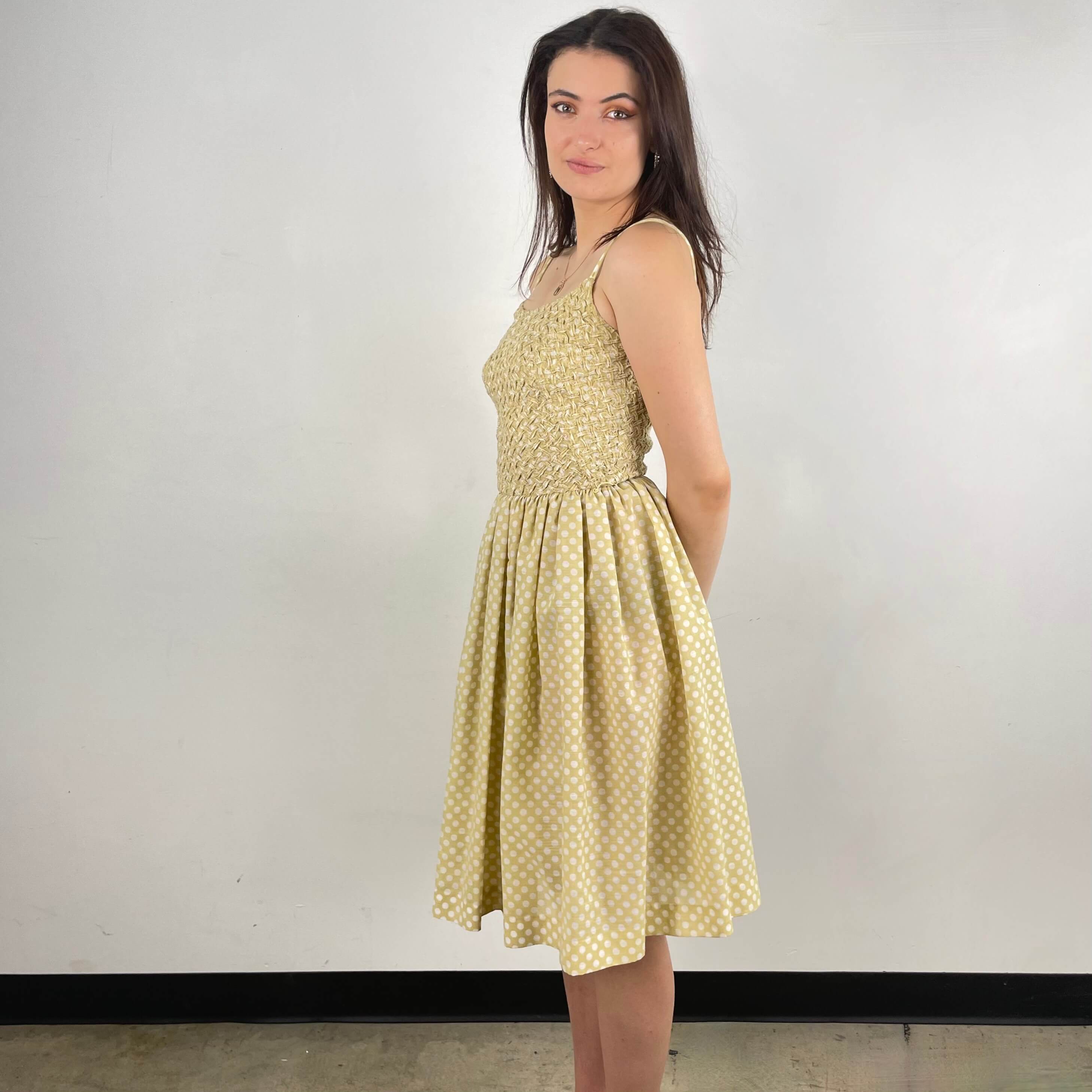 Side view of 1950s Polka Dot Sleeveless Dress size Small sold at bohemevintage.com Montreal