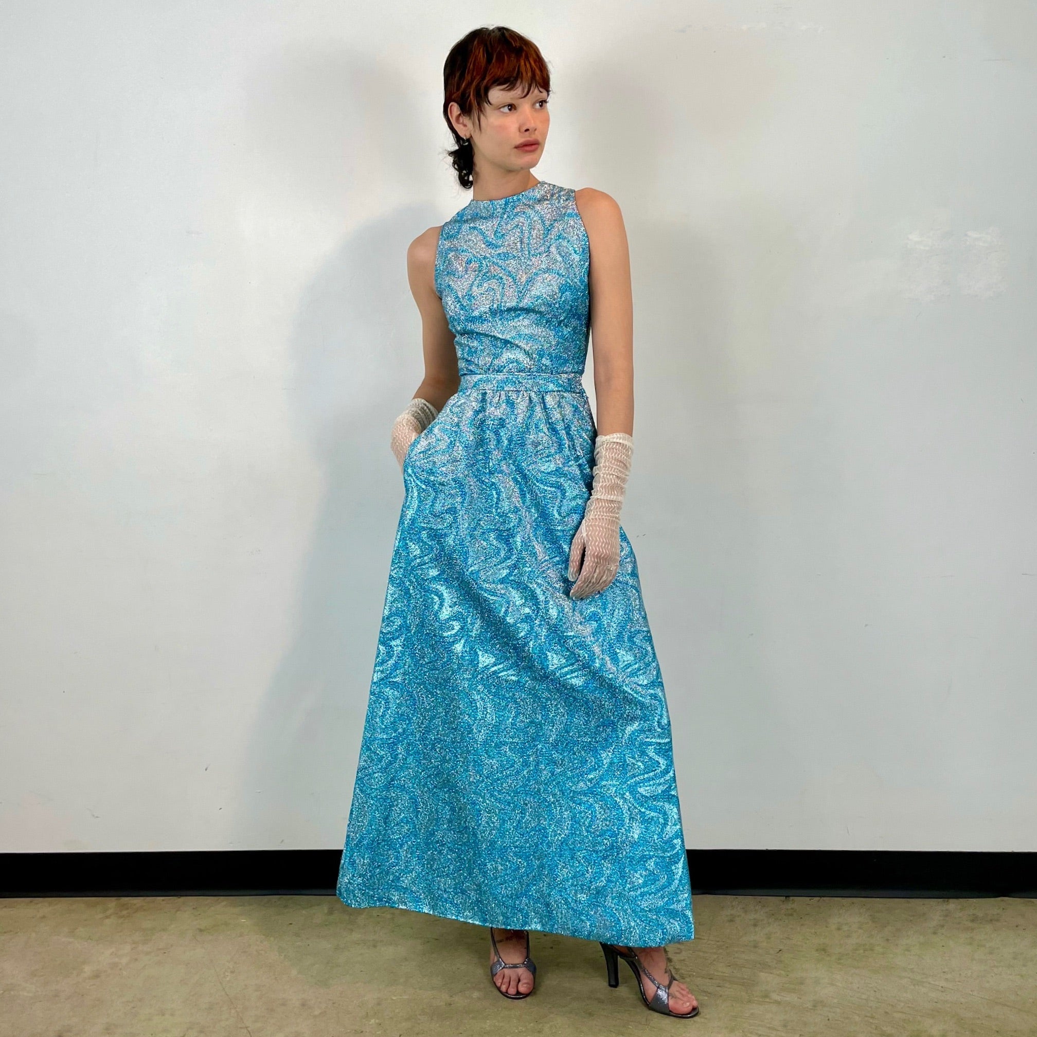 Boheme Vintage 1960s handmade turquoise floral Lurex maxi dress set with fitted sleeveless bodice and flared satin‑lined skirt.