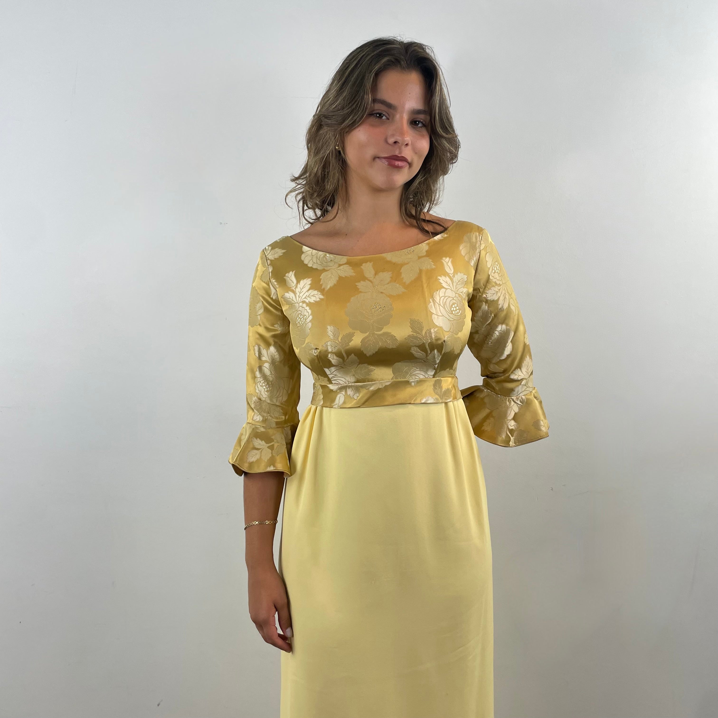 Boheme Vintage 1960s gold brocade and yellow crepe empire waist gown with flounce sleeves and flowing skirt.