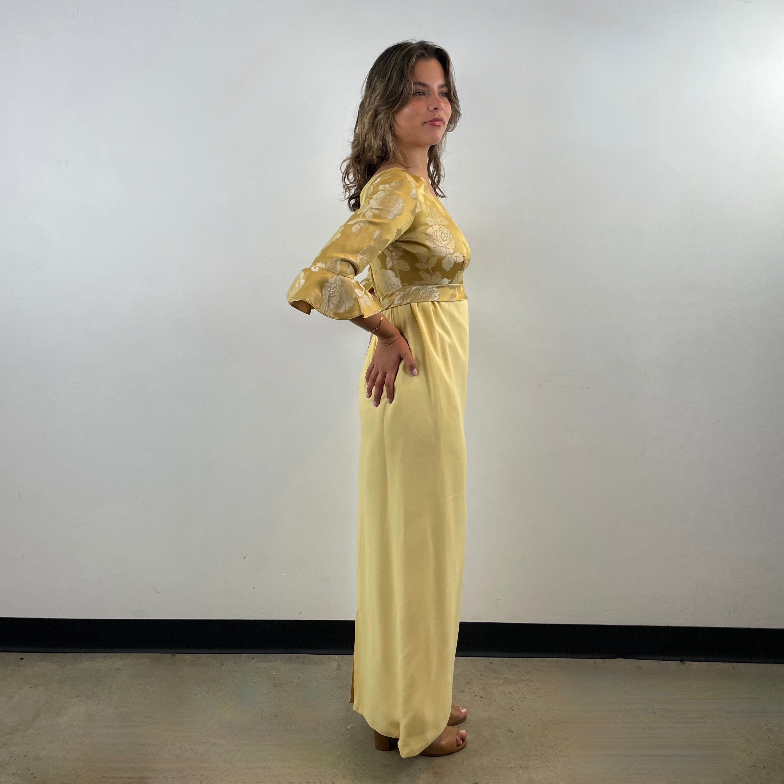 Boheme Vintage 1960s gold brocade and yellow crepe empire waist gown with flounce sleeves and flowing skirt.