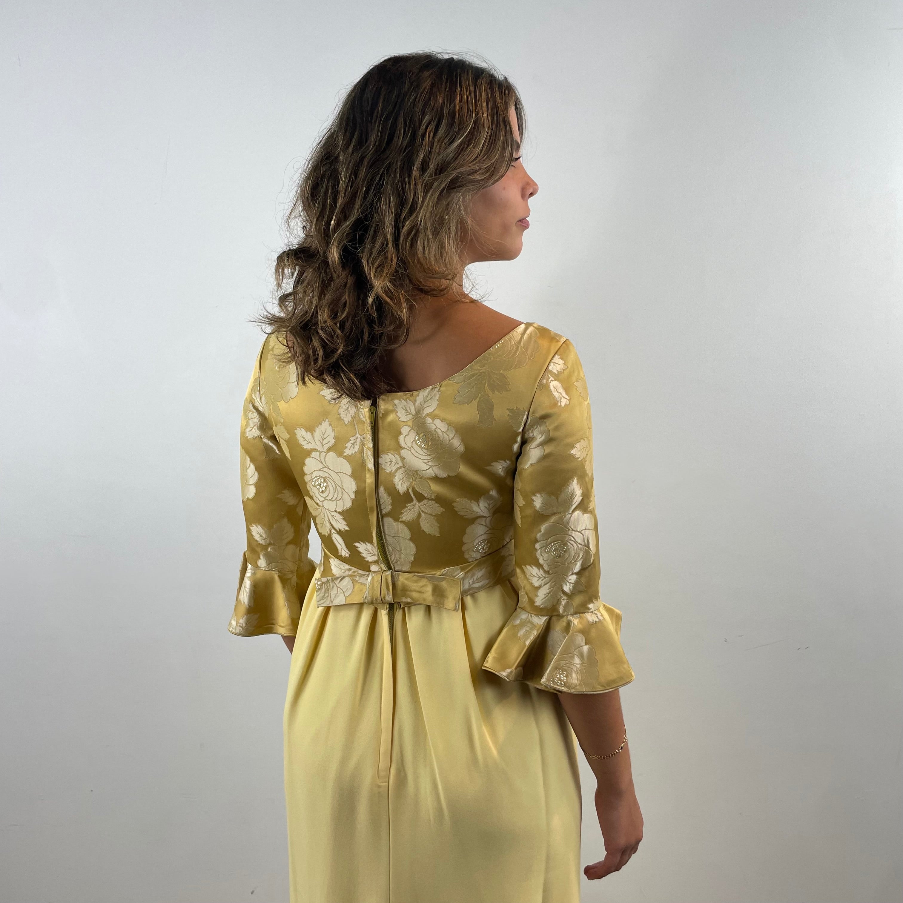 Boheme Vintage 1960s gold brocade and yellow crepe empire waist gown with flounce sleeves and flowing skirt.