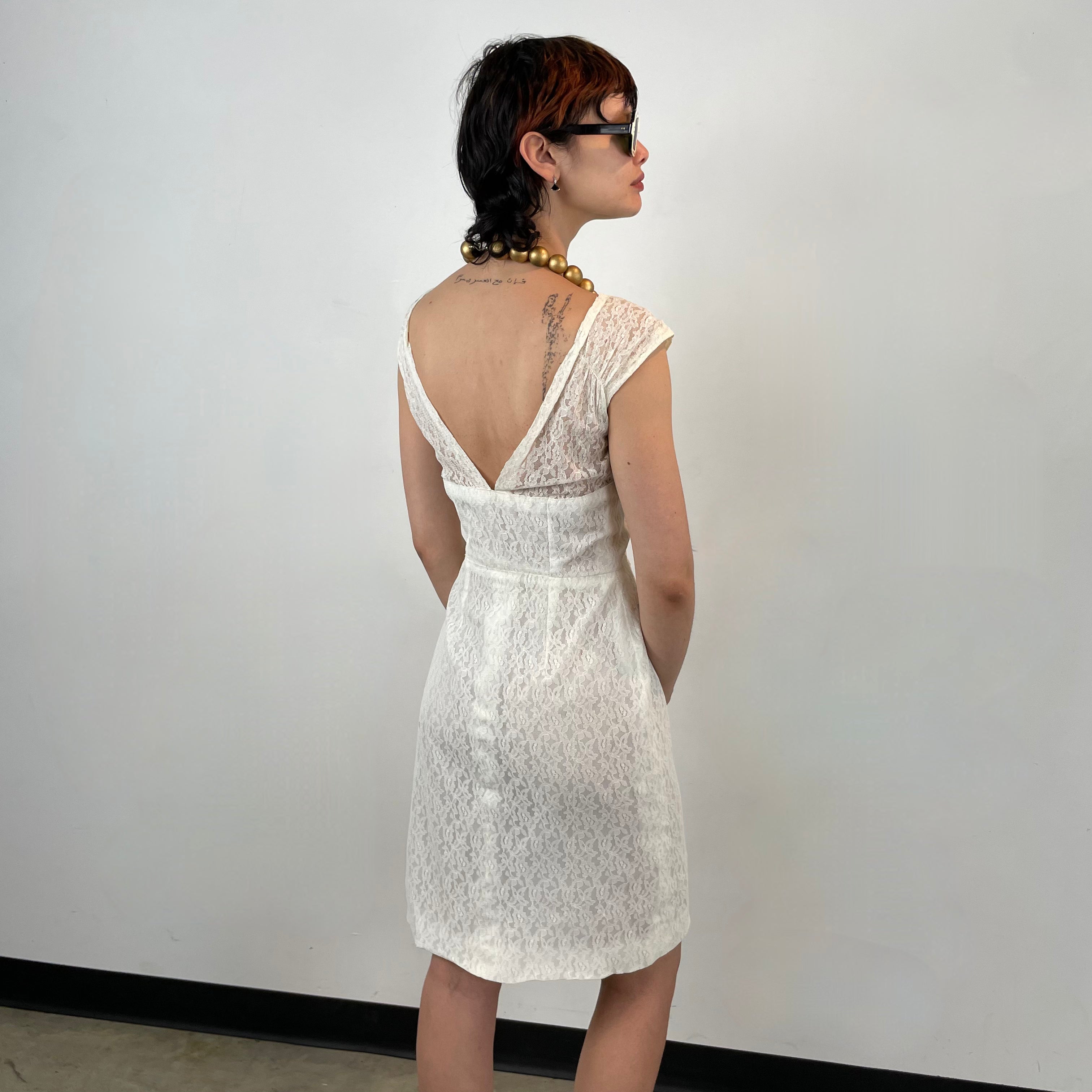 Back view of 1960s Ivory Lace Dress
Size Small
Sold at bohemevintage.com
Montréal