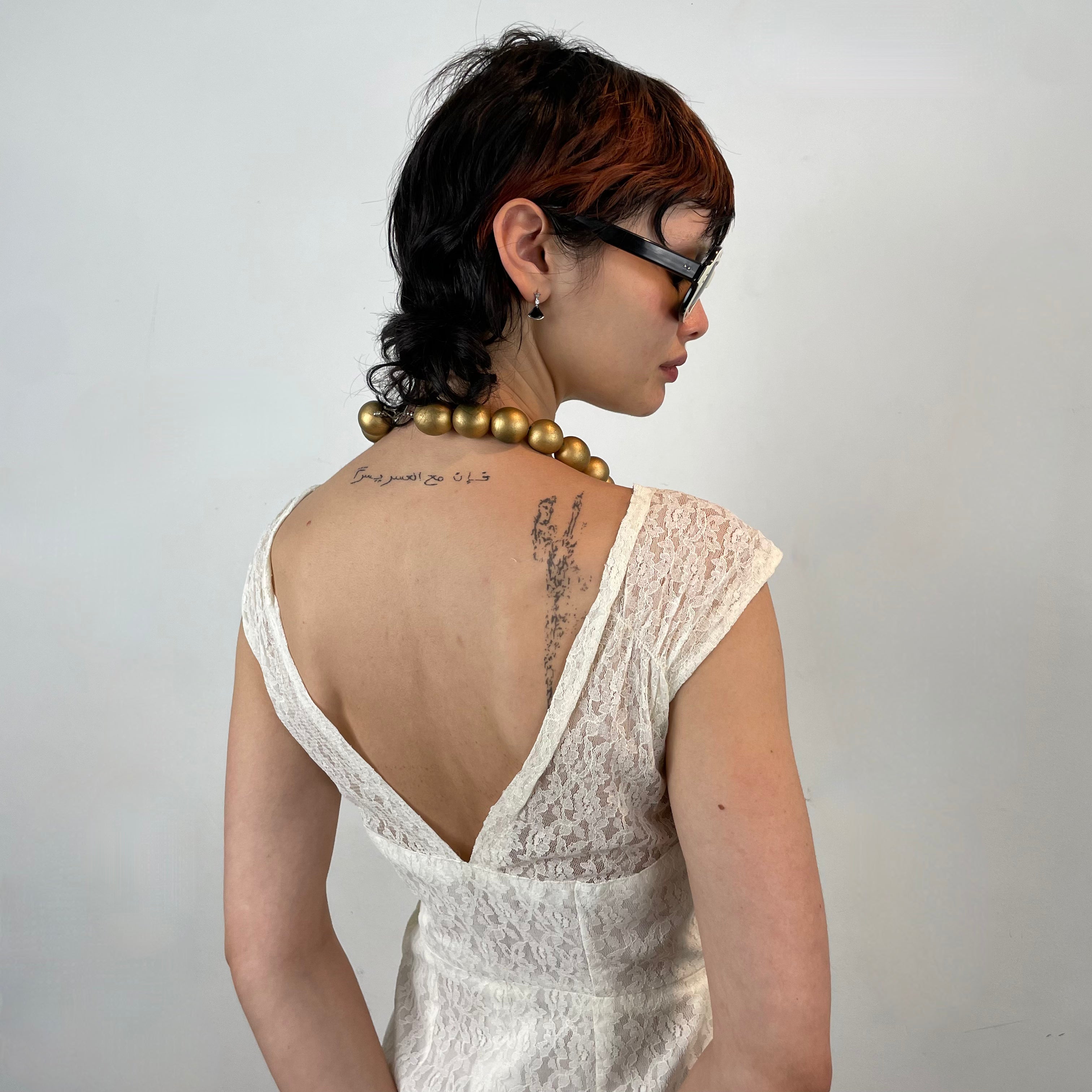 Close up back view of 1960s Ivory Lace Dress
Size Small
Sold at bohemevintage.com
Montréal