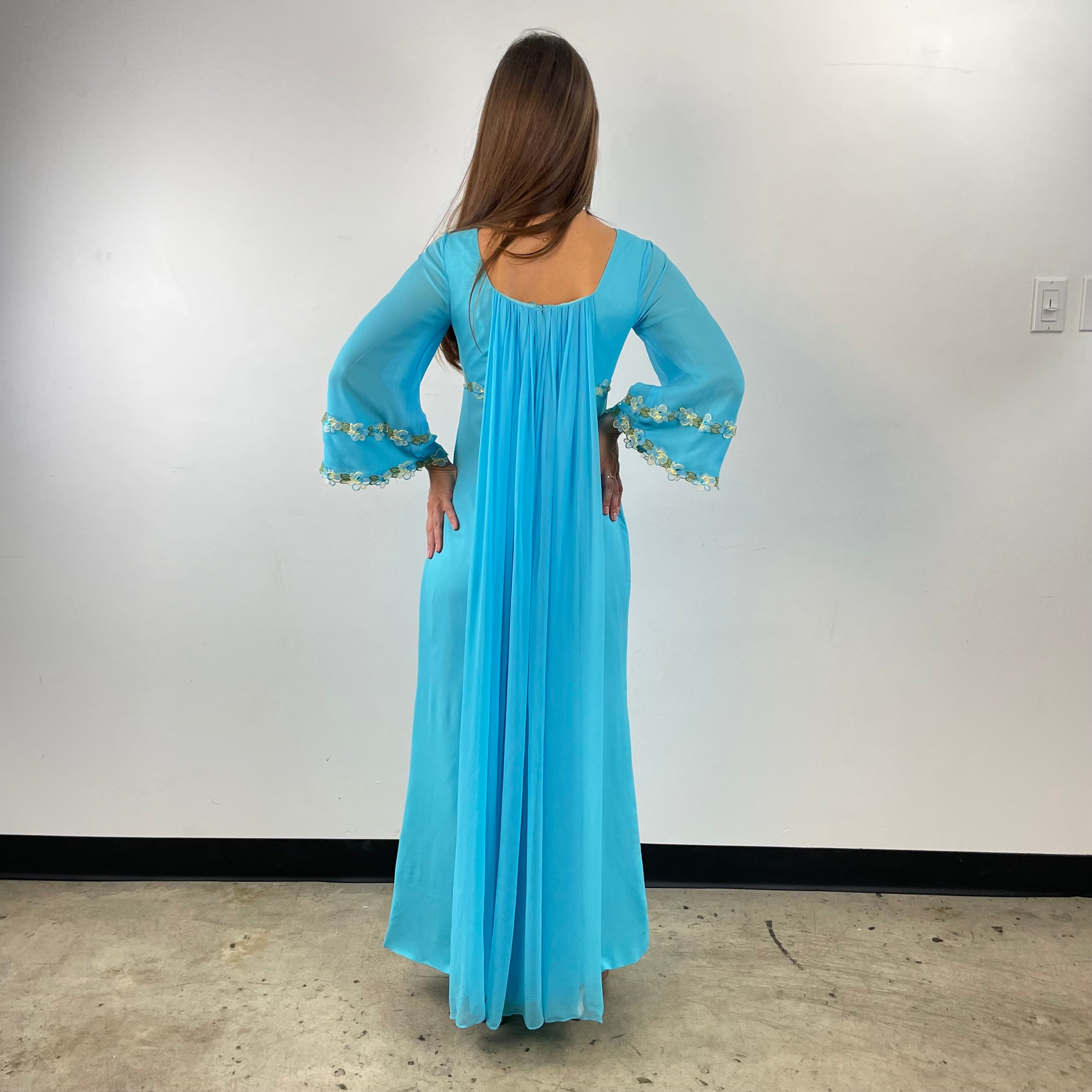 Back view of 1970s Turquoise Silk Chiffon Long-Sleeved Maxi Dress Small sold on bohemevintage.com Montreal