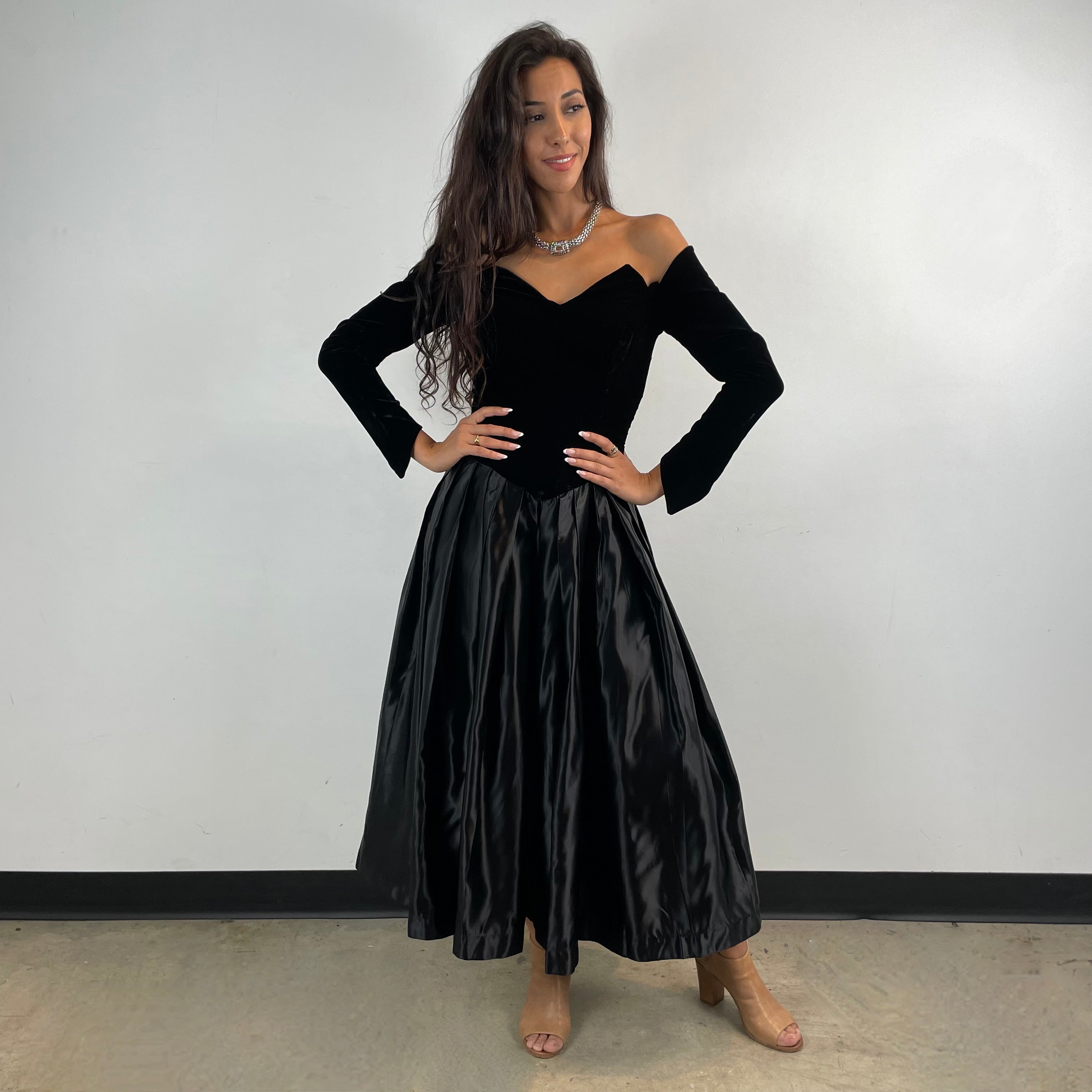 Front view of 1980s/90s Off-The-Shoulder Long Sleeve Black Bustier Midi Dress Size Small sold at bohemevintage.com Montreal