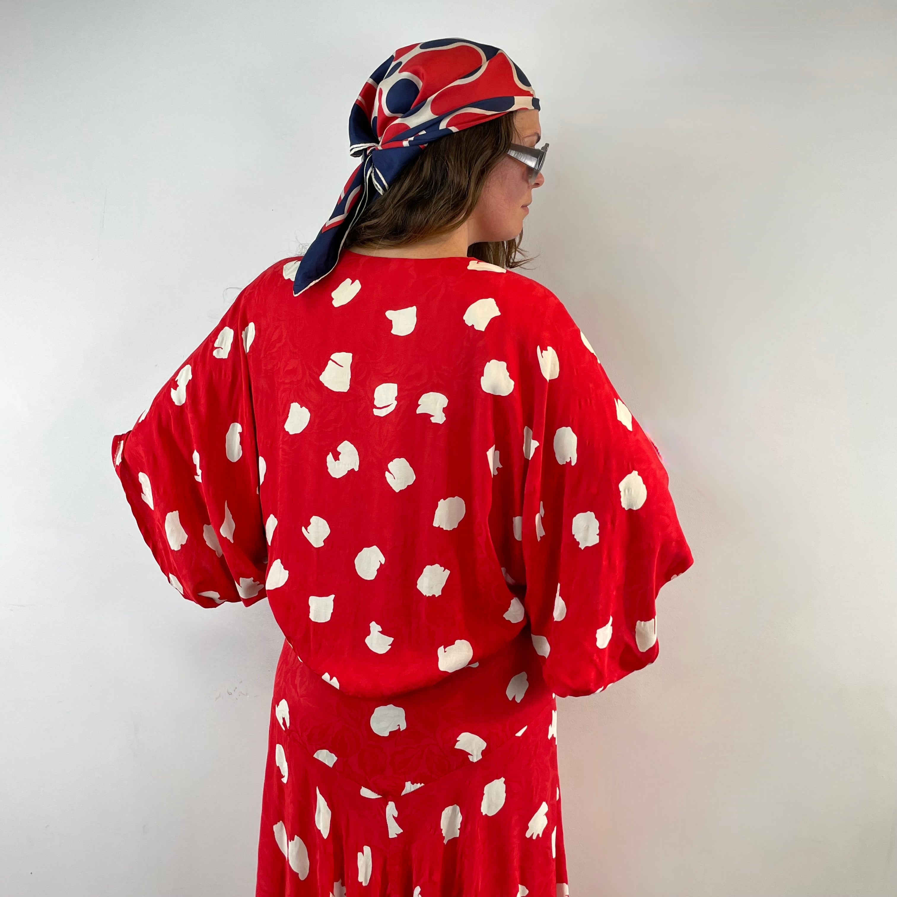 Boheme Vintage 1980s Jackie Bernard for EKLEKTIC red and white viscose kimono-style midi wrap dress with dolman sleeves and pleated skirt.