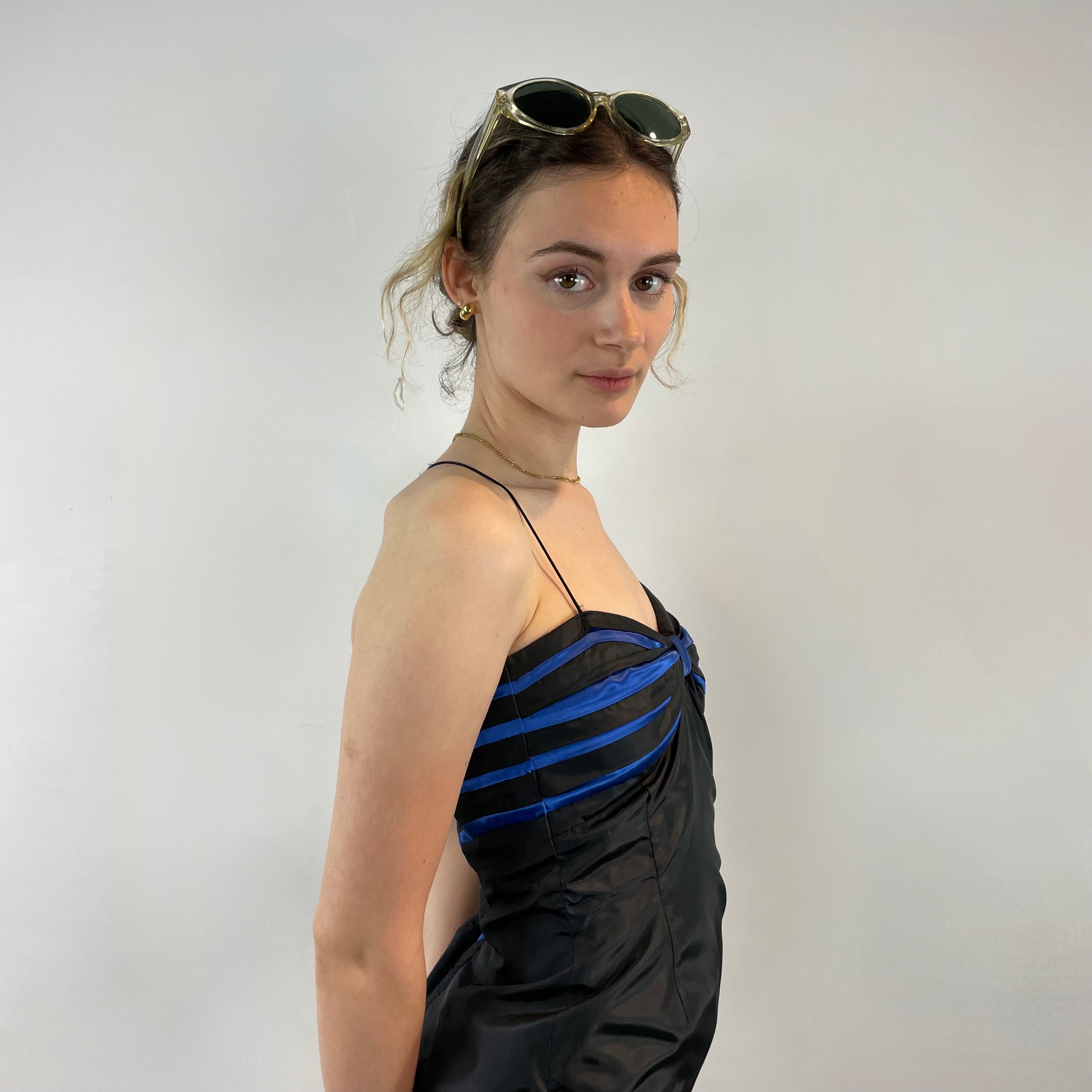 Boheme Vintage 1990s–2000s black satin bustier pencil dress with blue pleated detailing, spaghetti straps, and fitted silhouette.