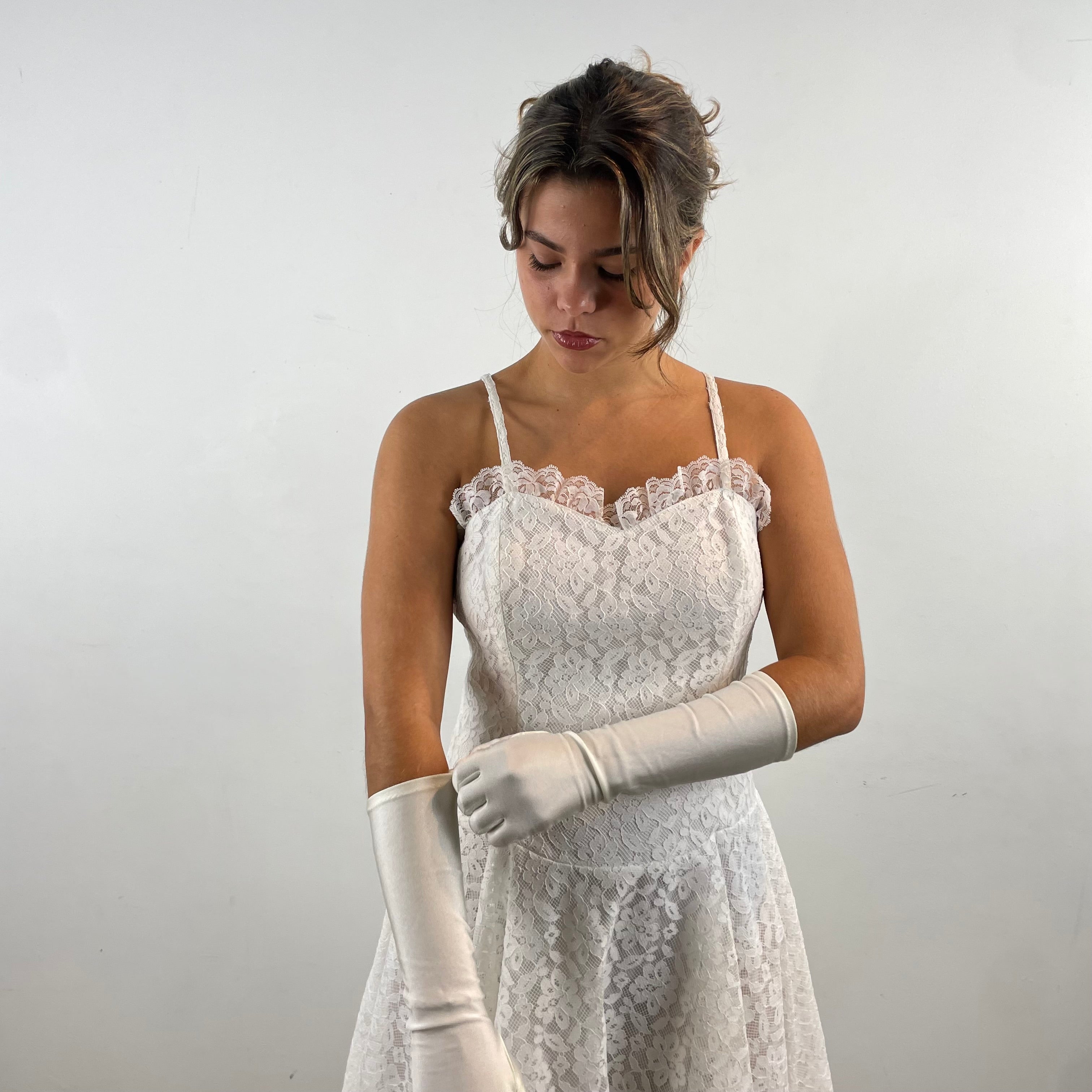 Boheme Vintage 1990s Algo Boutique white lace bustier dress with narrow straps, flared skirt, and layered tulle hem.