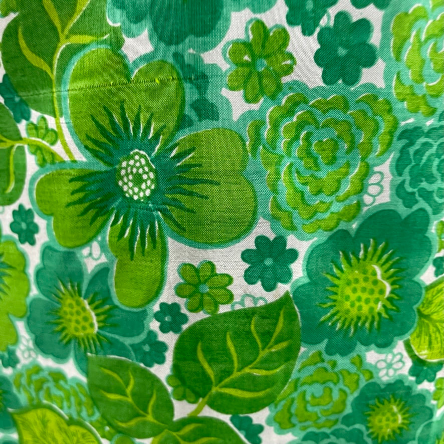 Close-up of floral printed fabric of 1970s Bold Print Long-Sleeved Silk Maxi Dress Size Medium sold at bohemevintage.com Montreal