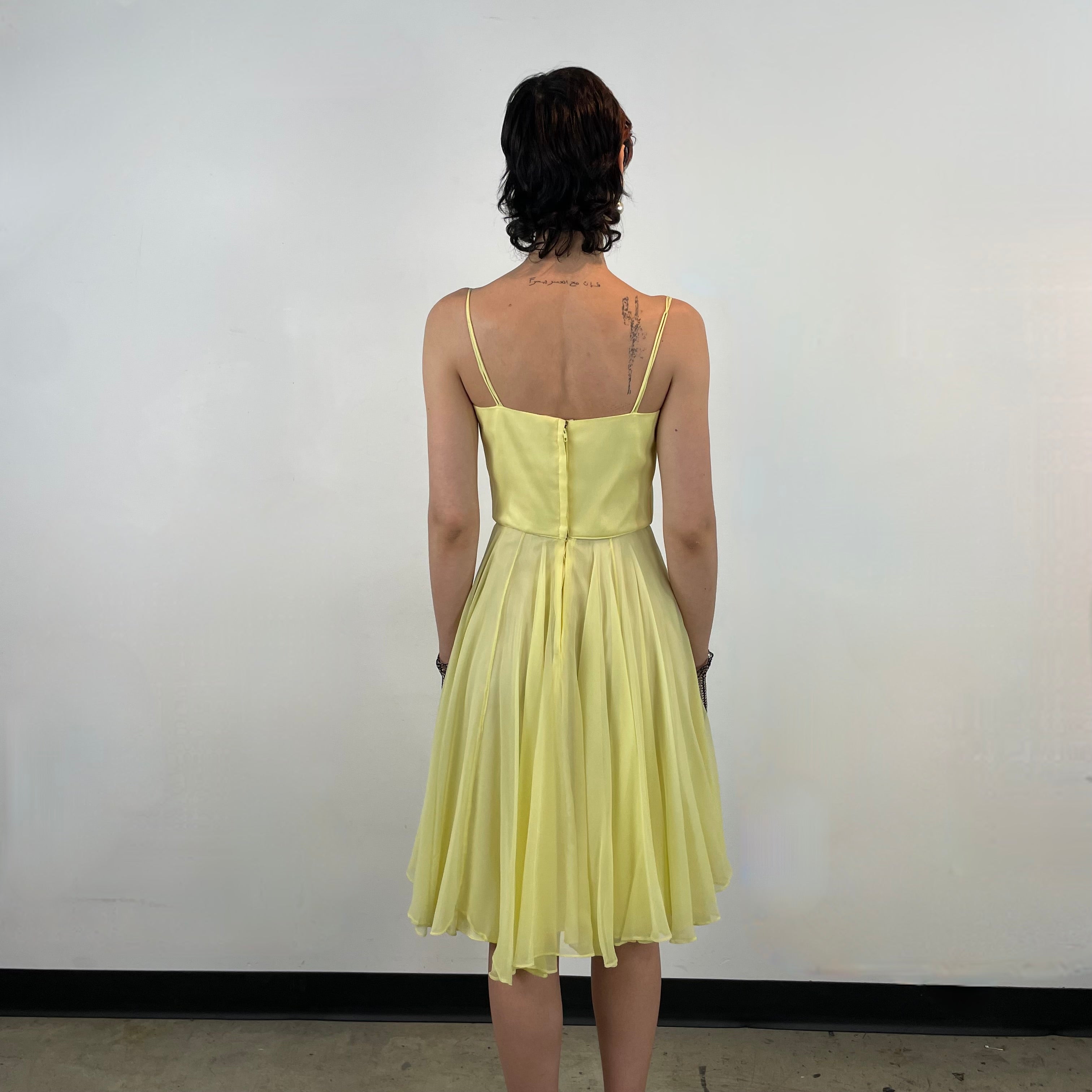 Back view of 1960s Yellow Chiffon Cocktail Dress
size Small
sold at bohemevintage.com
Montréal