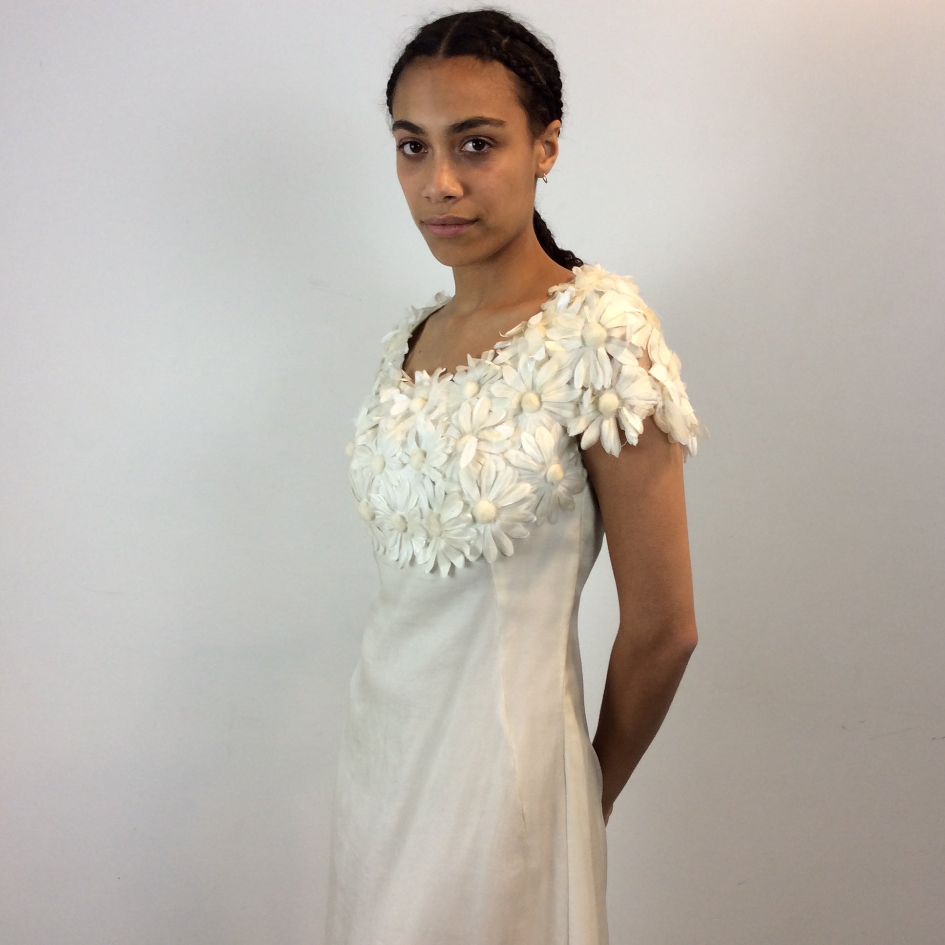 Close up view of 1970s Daisy Embellished Ivory Organza Maxi Dress
Size Small
Sold at bohemevintage.com
Montréal