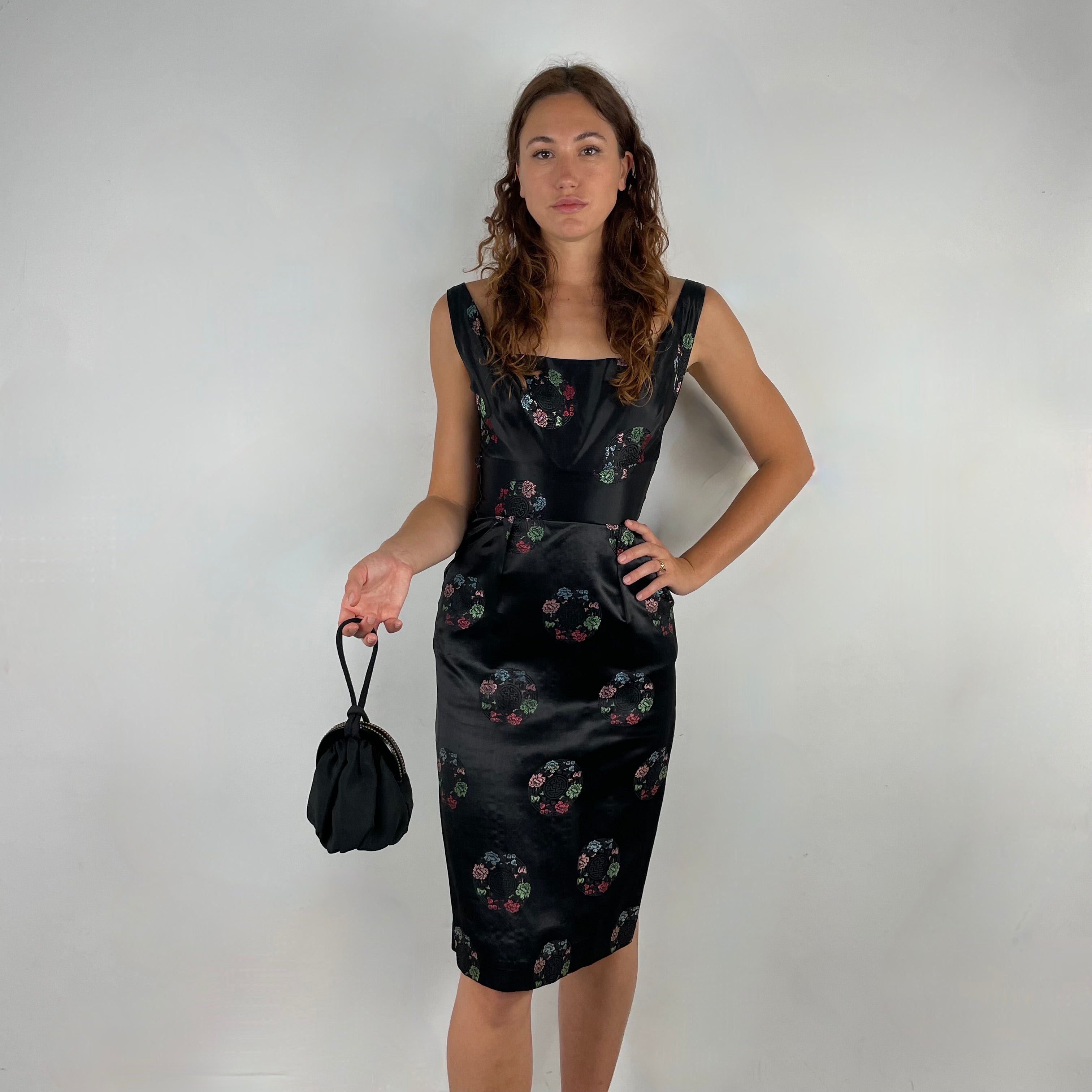 Front view of 1960s Black Satin Brocade Midi Dress
Size Small
Sold at bohemevintage.com
Montréal