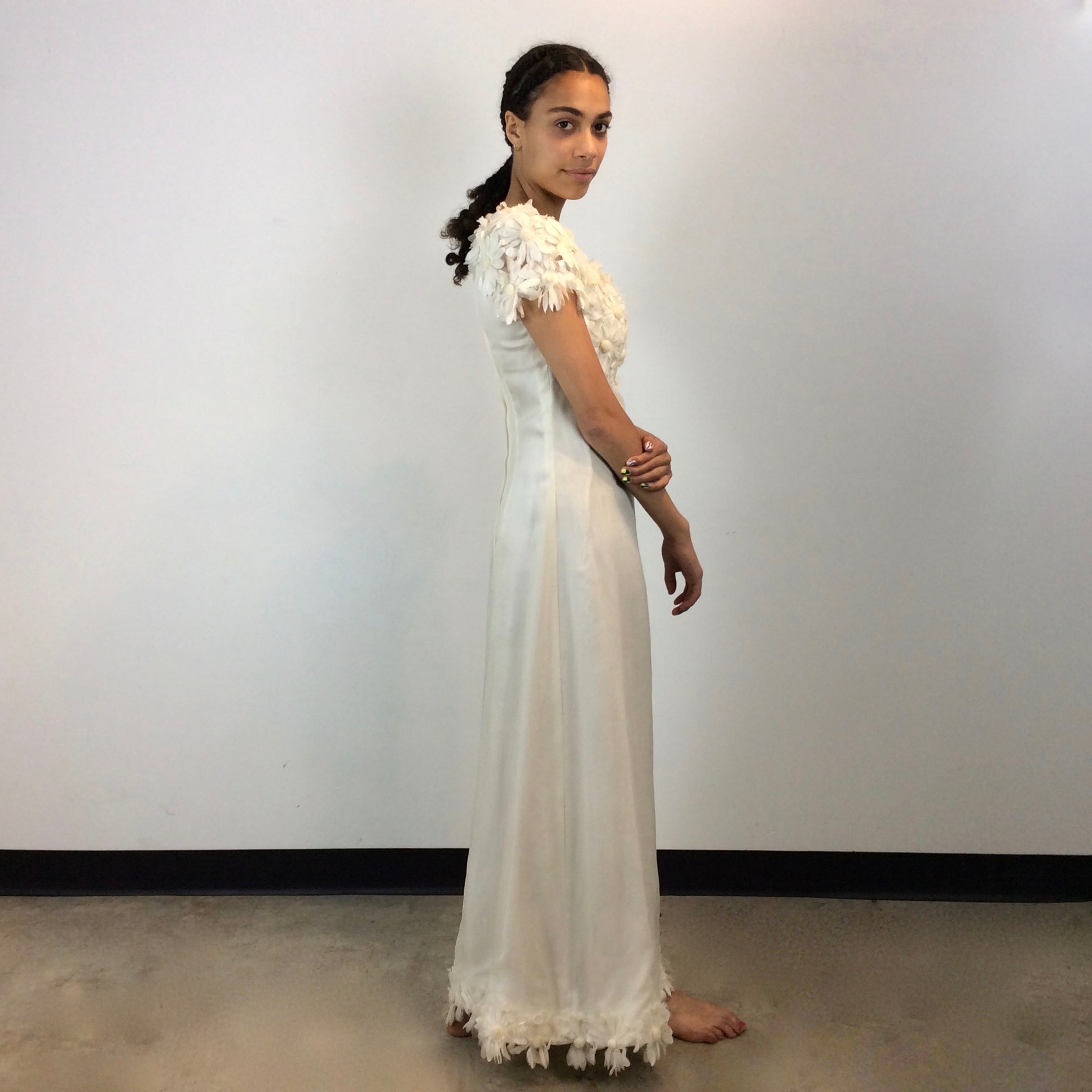 Side view of 1970s Daisy Embellished Ivory Organza Maxi Dress
Size Small
Sold at bohemevintage.com
Montréal