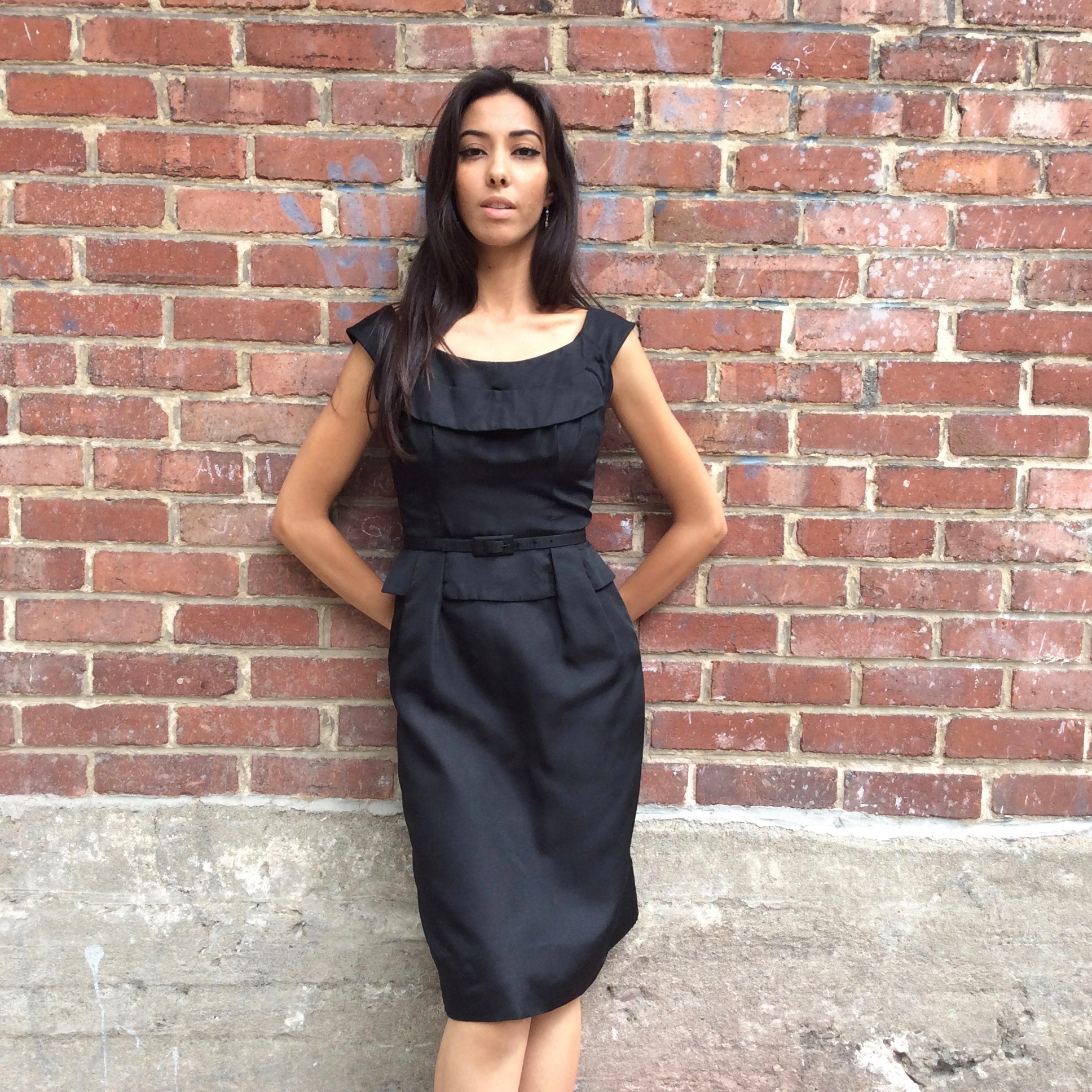 front view of 1950s Black Dress With Peplum
Size Extra-Small/Small
Sold at bohemevintage.com
Montréal