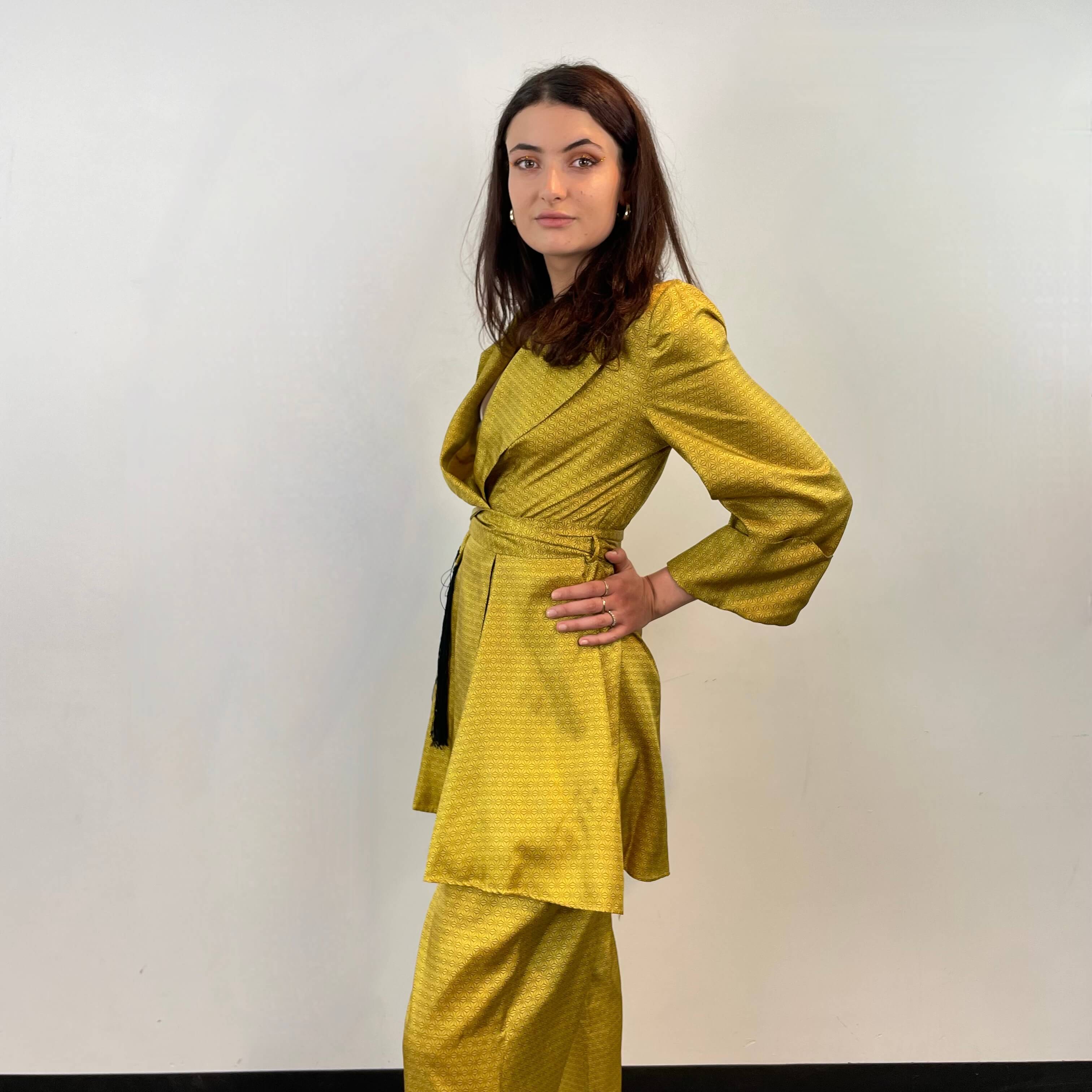 Side view of 1950s Gold Satin Robe and Pants Loungewear Set Size Small/Medium sold at bohemevintage.com Montreal