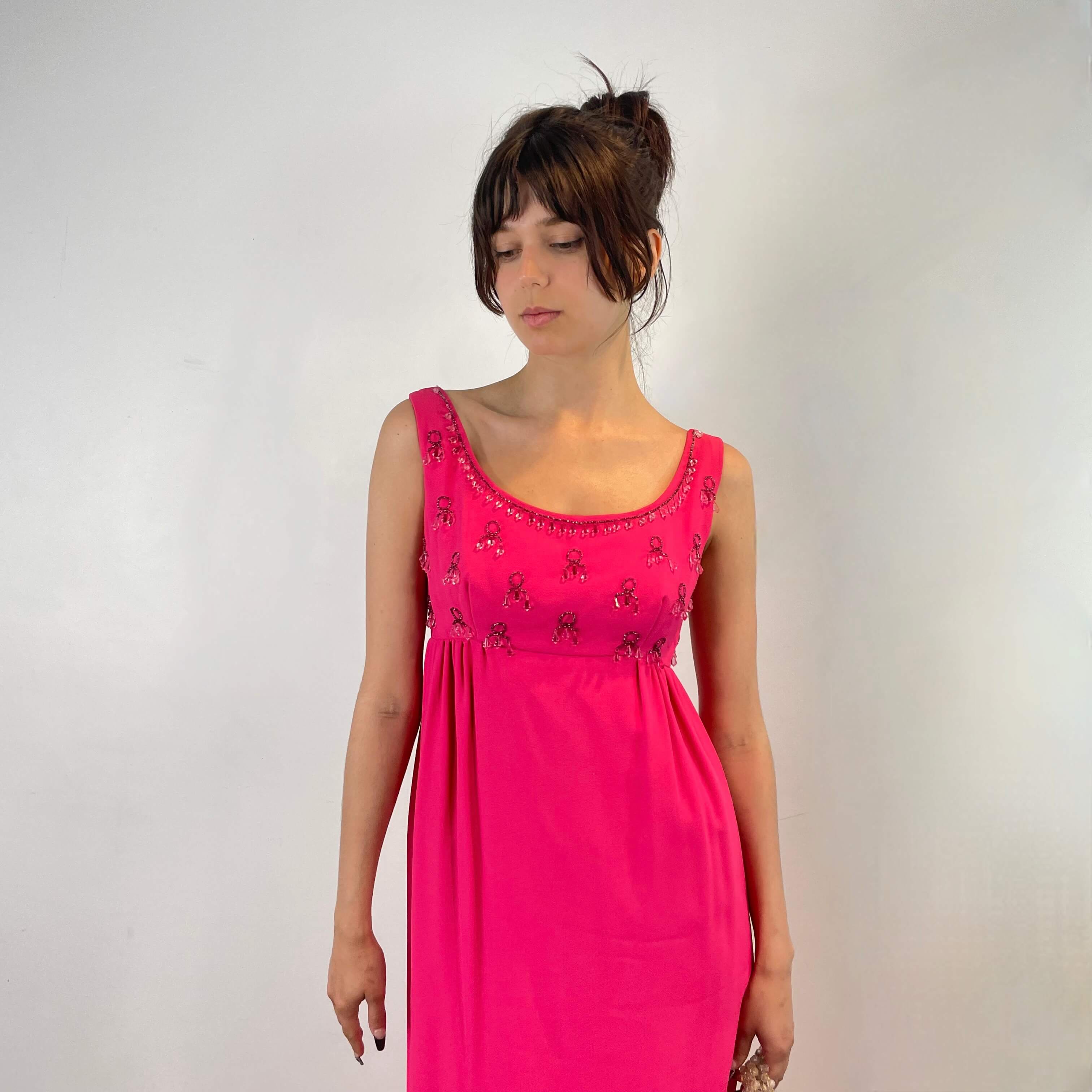 Front view of 1960s Fuchsia Empire Waist Beaded Gown Size X-Small/ Small sold at bohemevintage.com Montreal