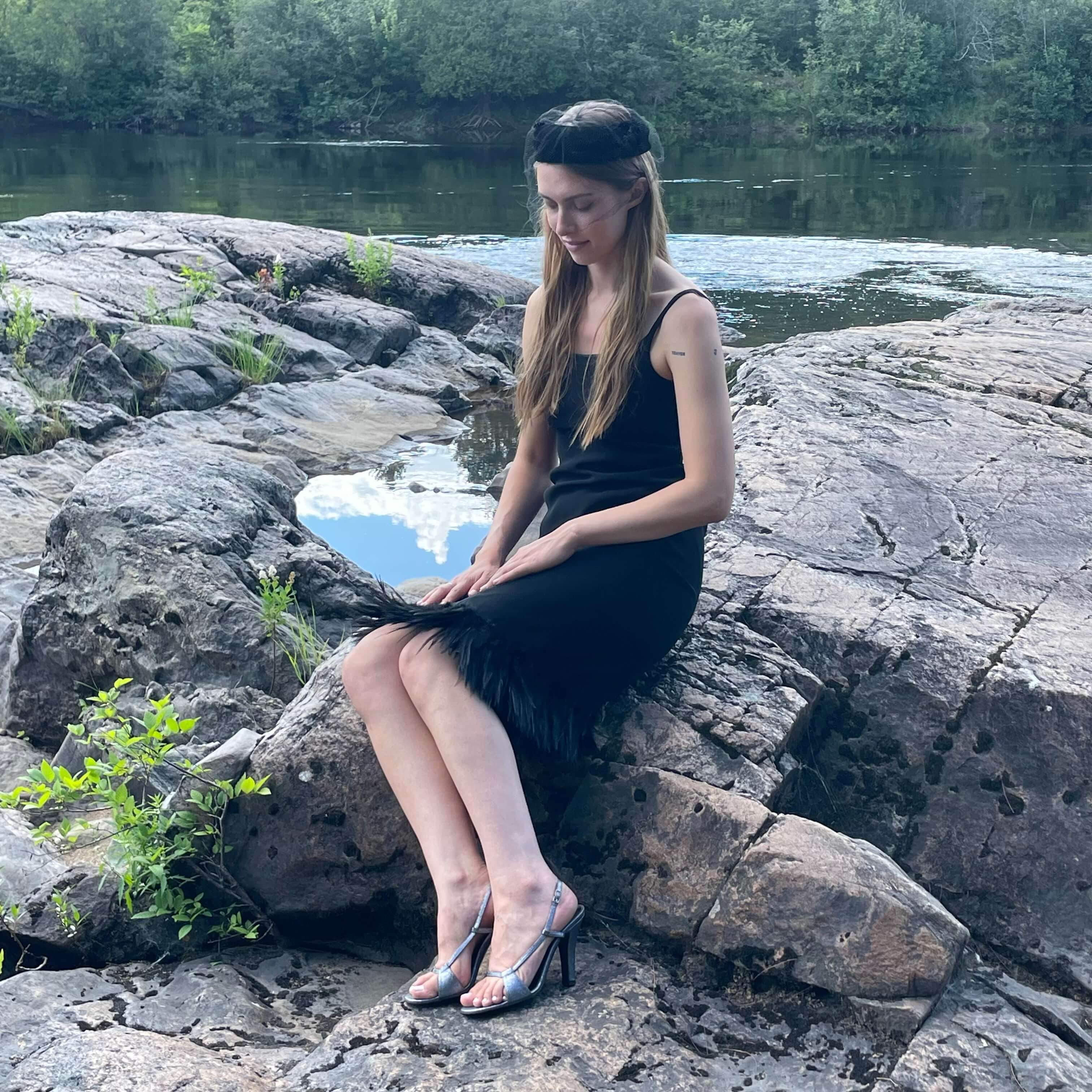 Front view of 1990s Black Slip Dress with Feathers Size small-Medium sold on bohemevintage.com Montreal