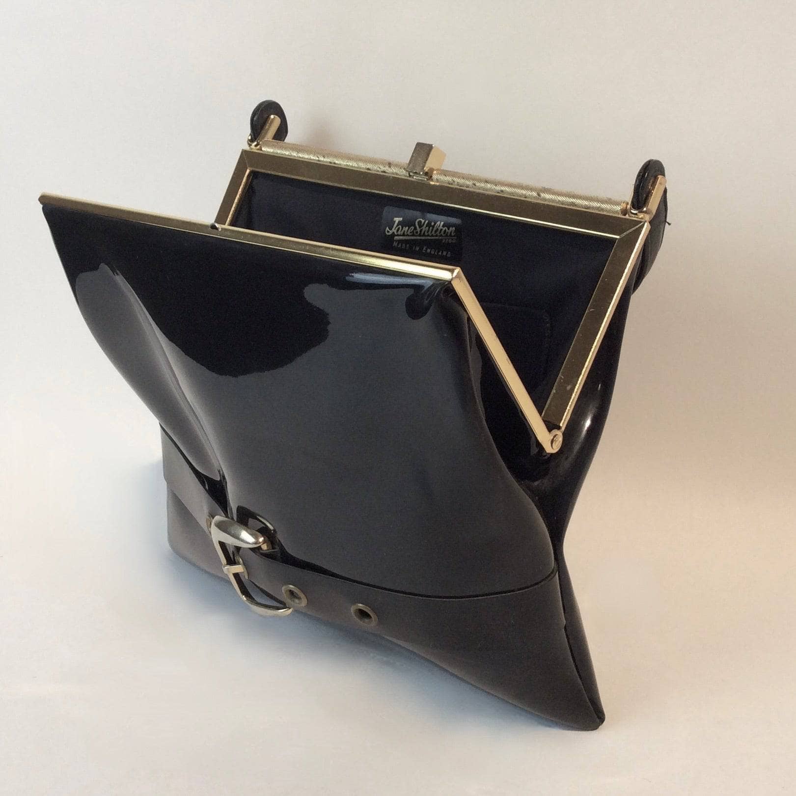 1950s-60s Black Patent Leather Handbag with Decorative Buckle Strap sold at bohemevintage.com Montreal