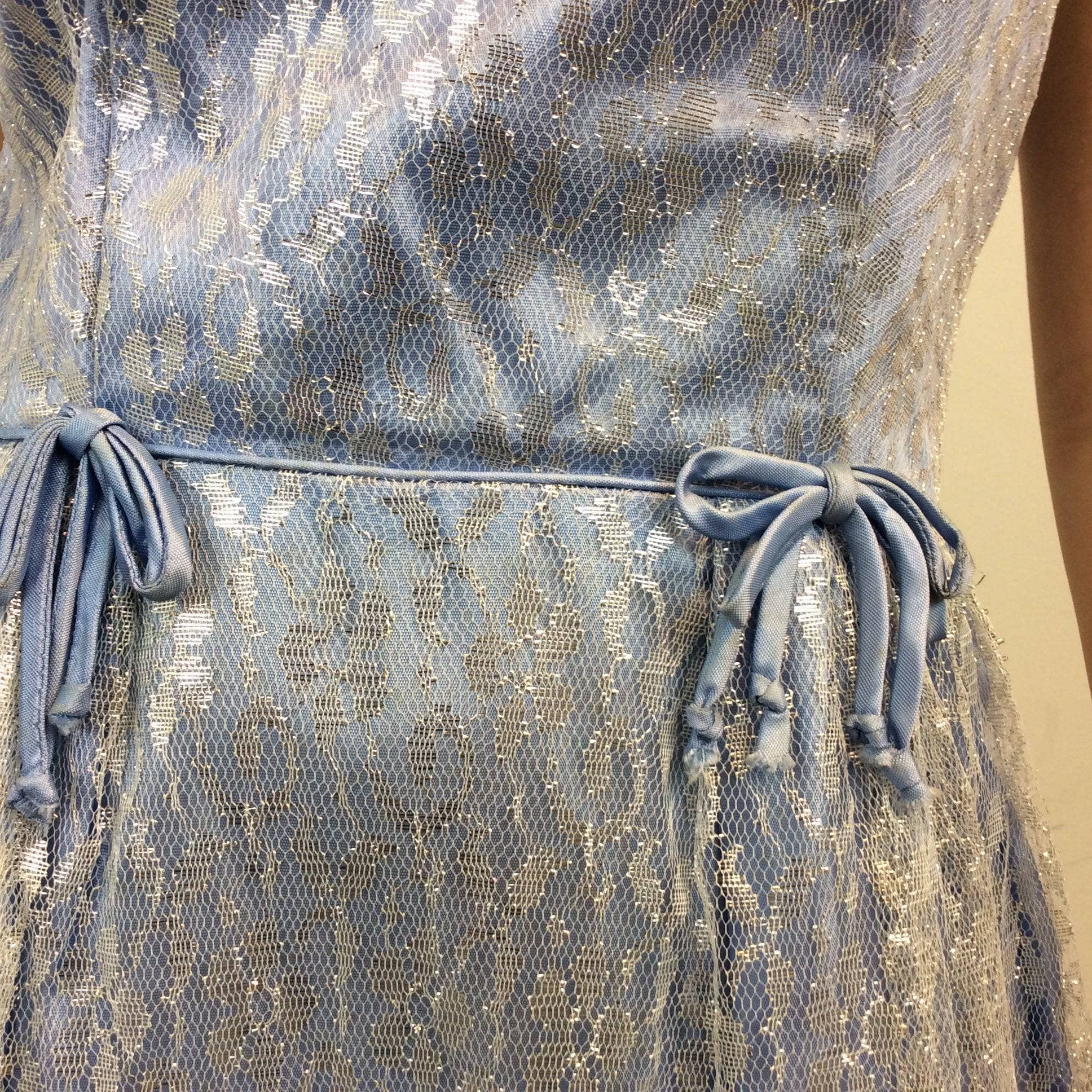 Waist detailing of 1950s Silver Lace Party Dress, Fit and Flare Dress, size Small-Medium, Colour Blue sold at bohemevintage.com Montreal