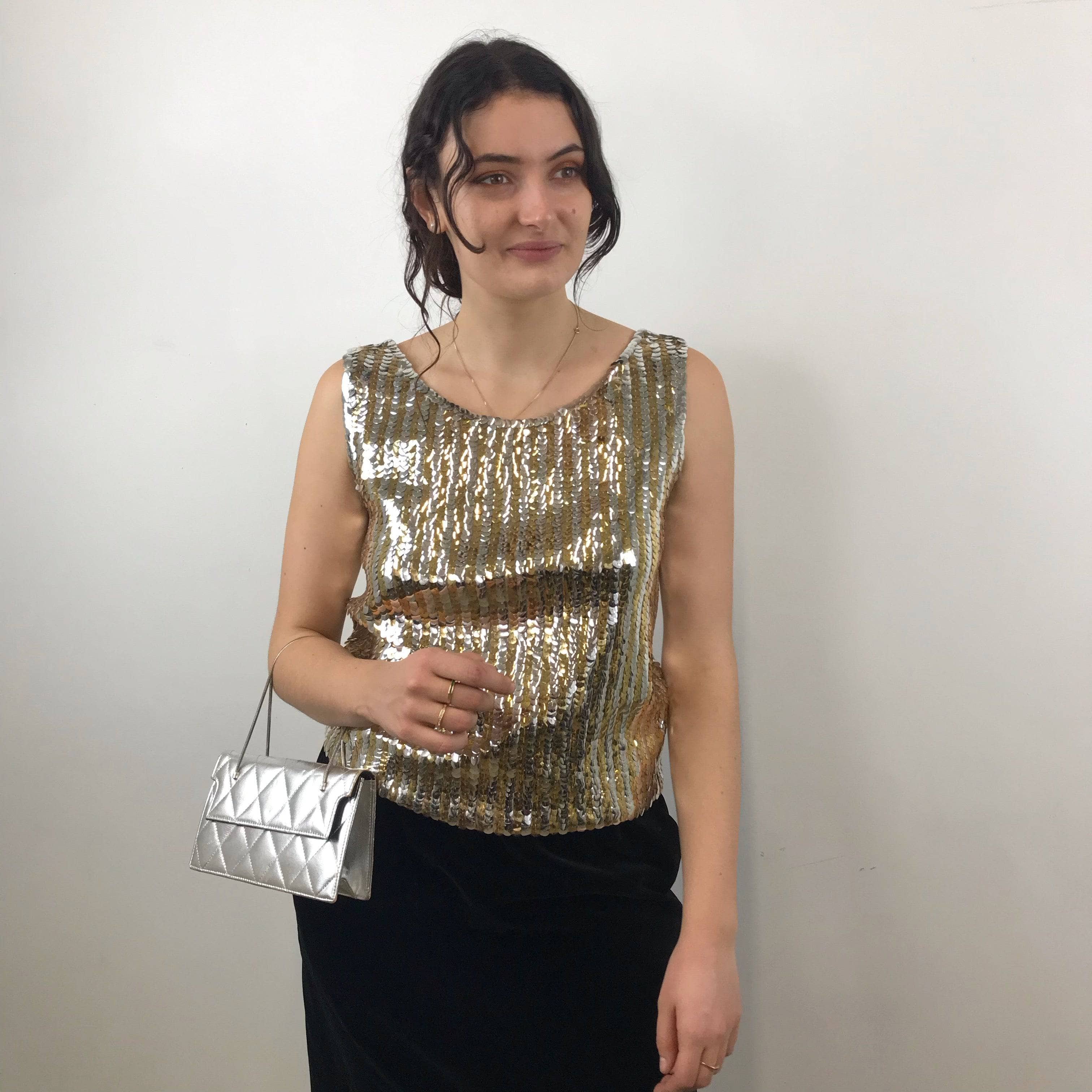 1960s Gold and Silver Sleeveless Sequin Top Size Medium - Large paired with Yves Saint Laurent black velvet skirt and 60s quilted silver evening bag sold by bohemevintage.com Montreal