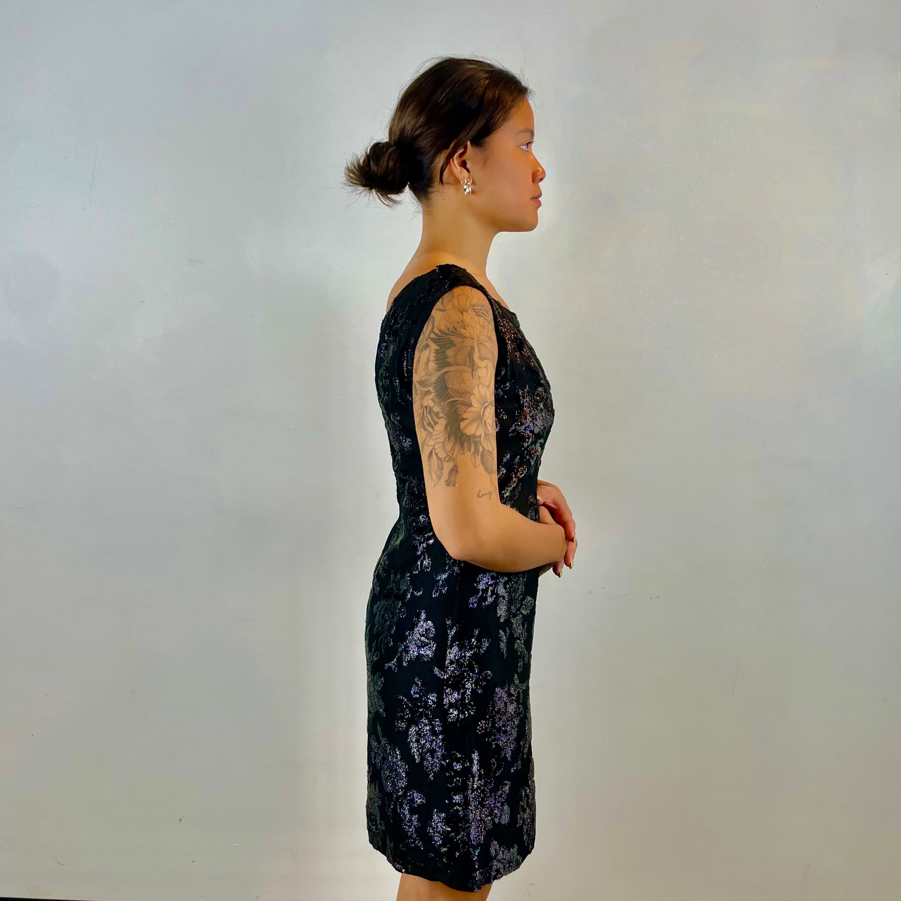  Side view of 1950s-1960s Floral Brocade Black Iridescent Cocktail Dress Size Medium sold at bohemevintage.com Montreal