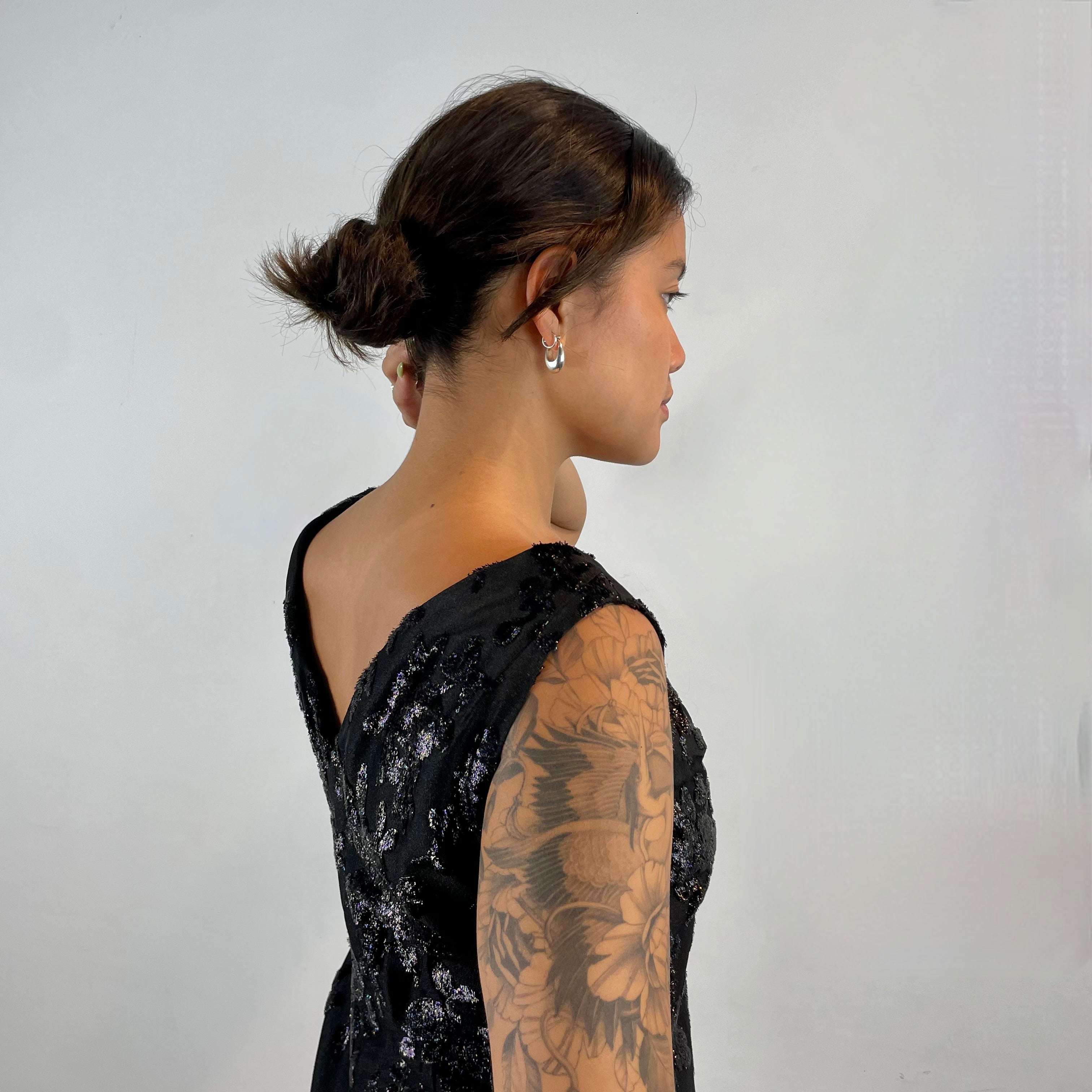 Back view of Low cut décolleté of 1950s-1960s Floral Brocade Black Iridescent Cocktail Dress Size Medium sold at bohemevintage.com Montreal 