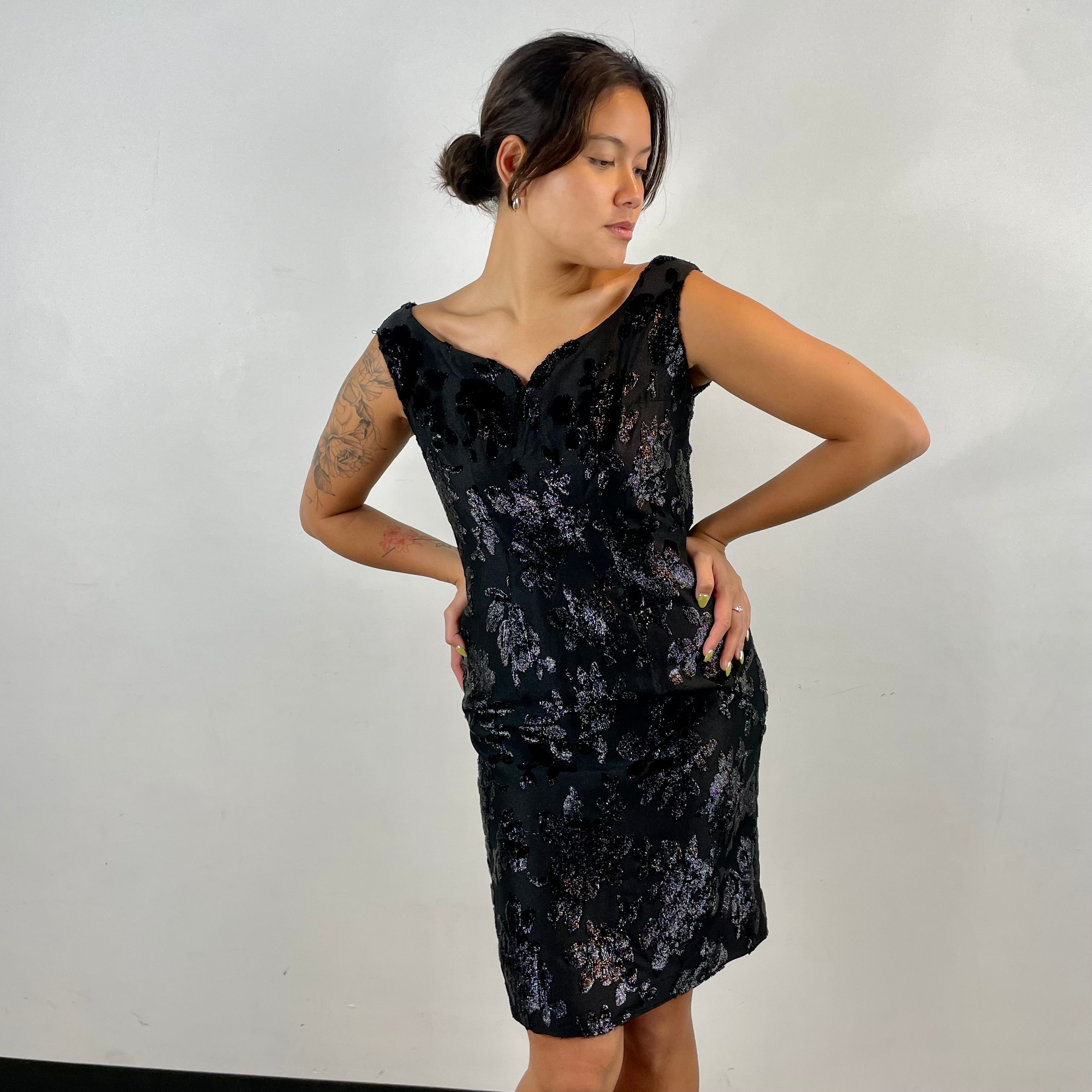 Front view of 1950s-1960s Floral Brocade Black Iridescent Cocktail Dress Size Medium sold at bohemevintage.com Montreal