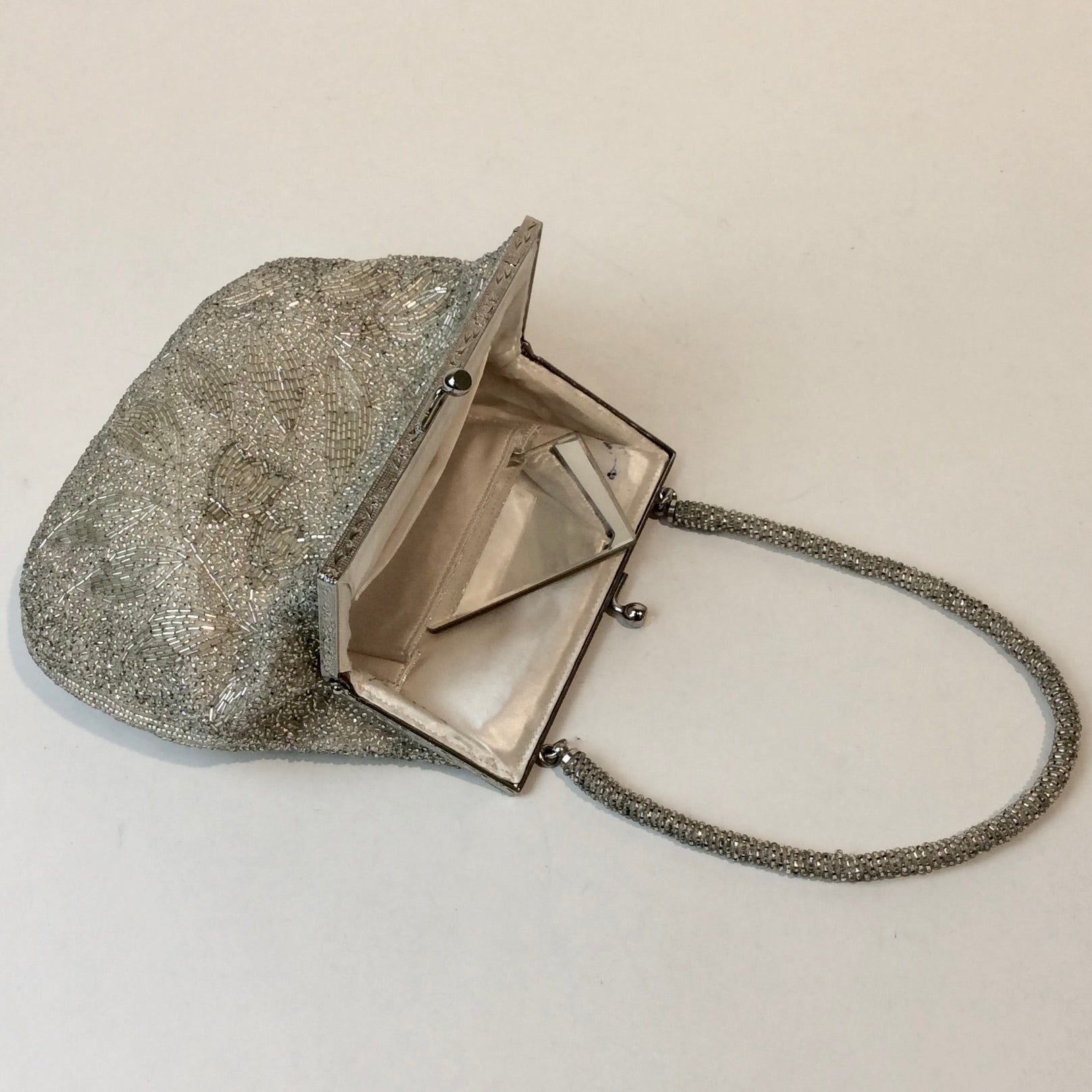 Boheme Vintage 1950s silver beaded evening handbag with floral beadwork, kiss‑lock closure, and beaded strap.