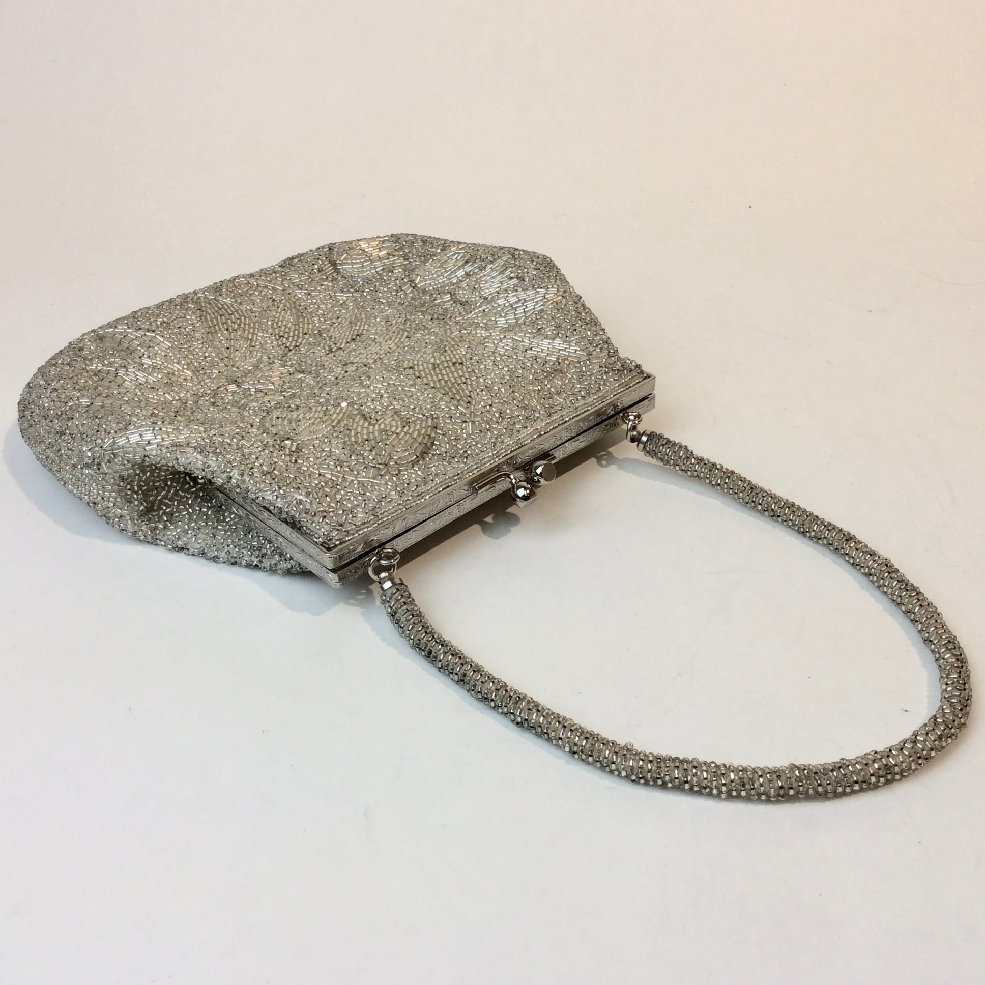 Boheme Vintage 1950s silver beaded evening handbag with floral beadwork, kiss‑lock closure, and beaded strap.