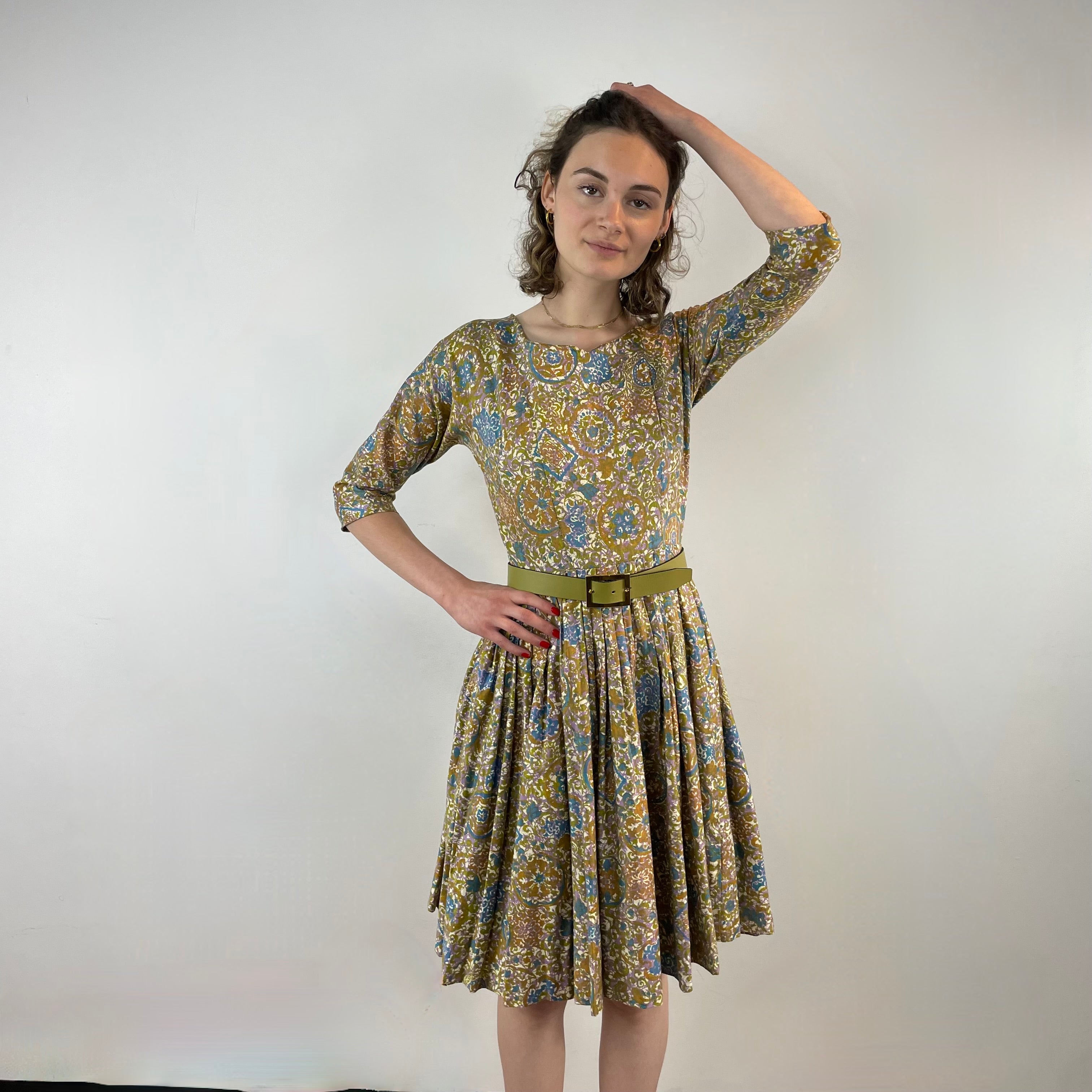 Front View of Boheme Vintage 1950s Meo of California floral cotton dress with pleated midi skirt and dolman sleeves.