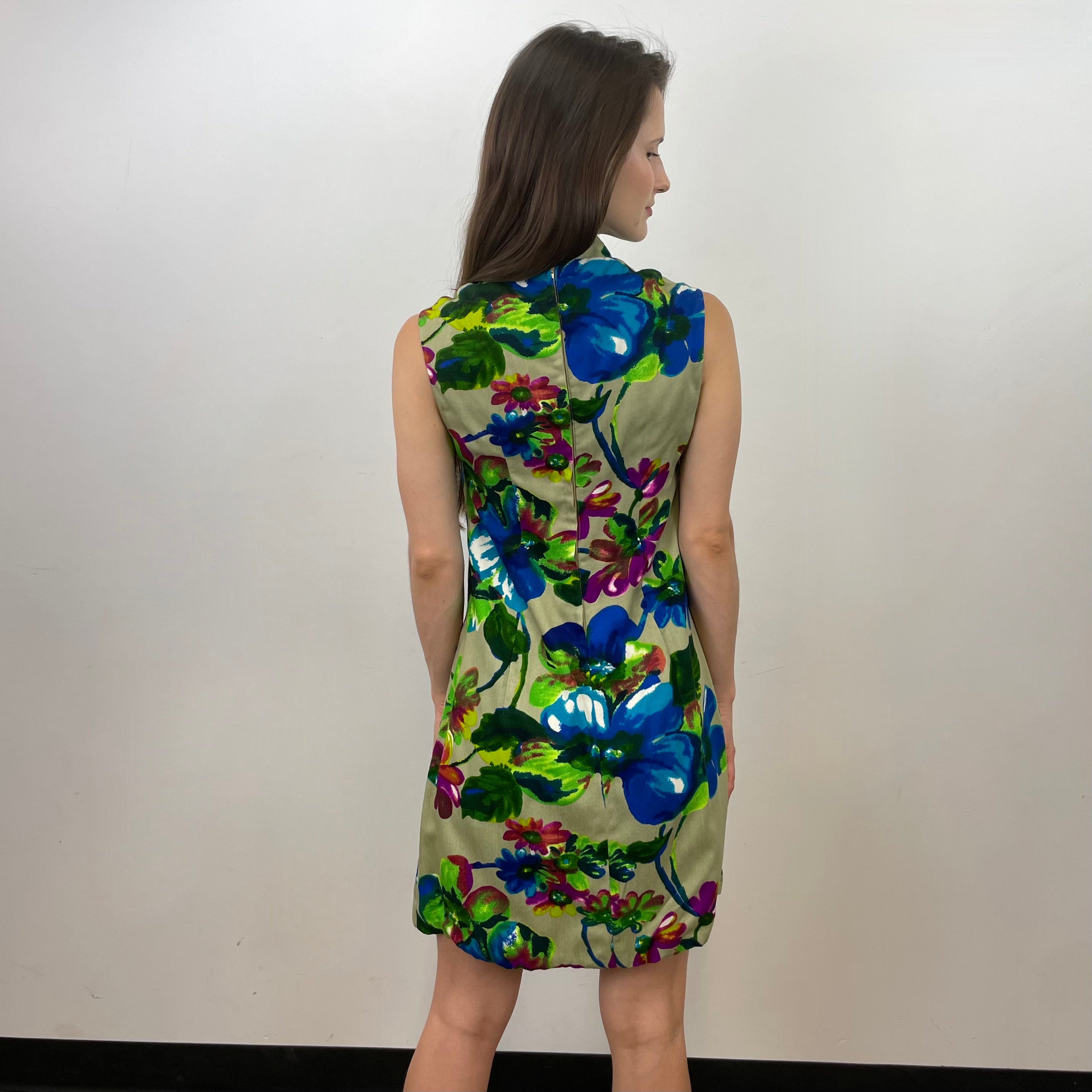 Boheme Vintage 1960s handmade floral tie-neck shift dress with textured bold-print fabric, V-neck opening, and relaxed silhouette.