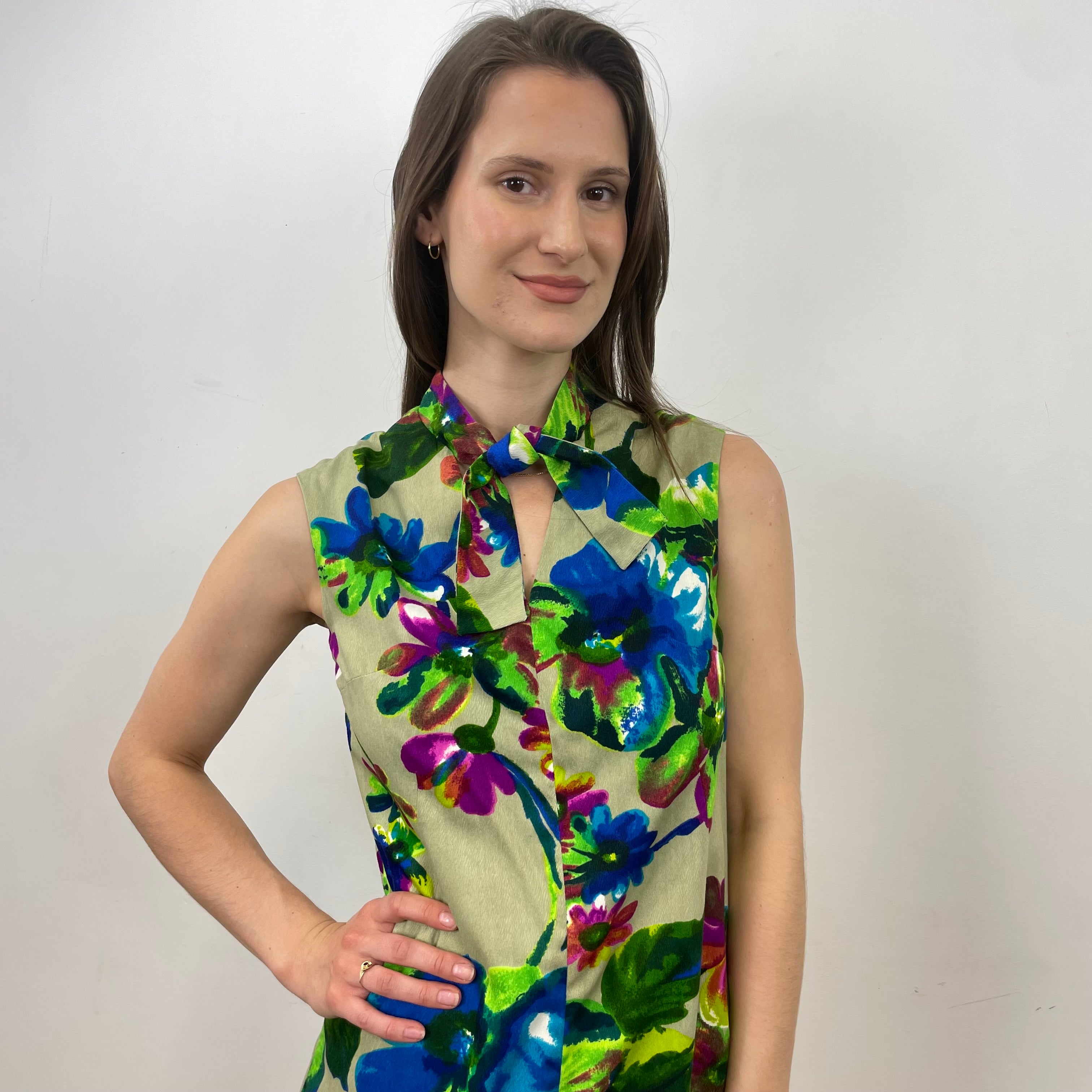 Boheme Vintage 1960s handmade floral tie-neck shift dress with textured bold-print fabric, V-neck opening, and relaxed silhouette.