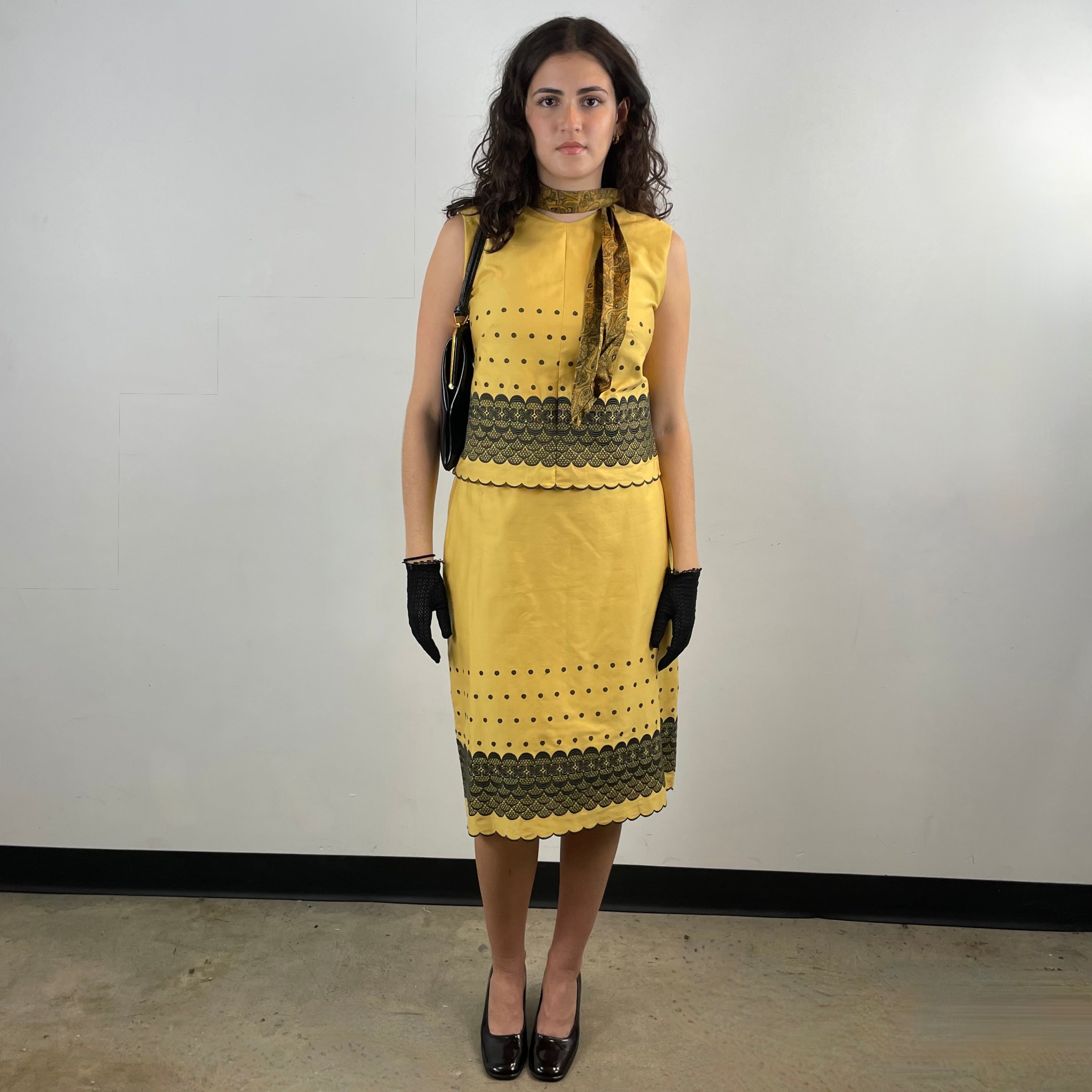 Boheme Vintage 1960s handmade black and gold embroidered cotton skirt and top set with sleeveless top, straight skirt, and scalloped embroidered hems.