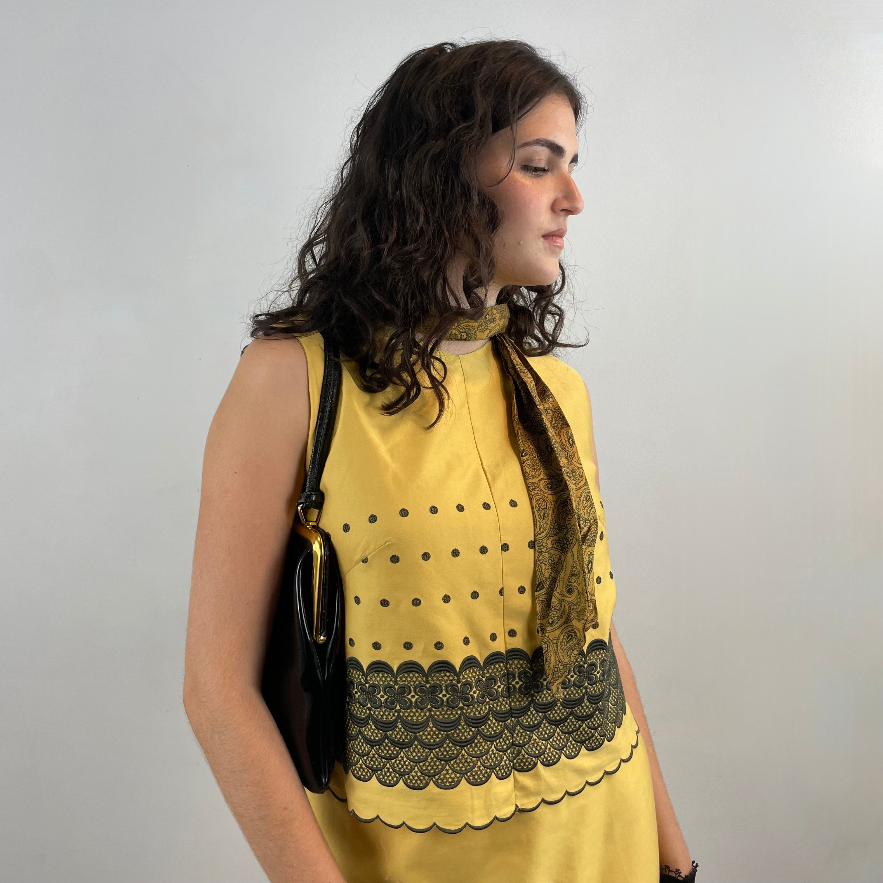 Boheme Vintage 1960s handmade black and gold embroidered cotton skirt and top set with sleeveless top, straight skirt, and scalloped embroidered hems.