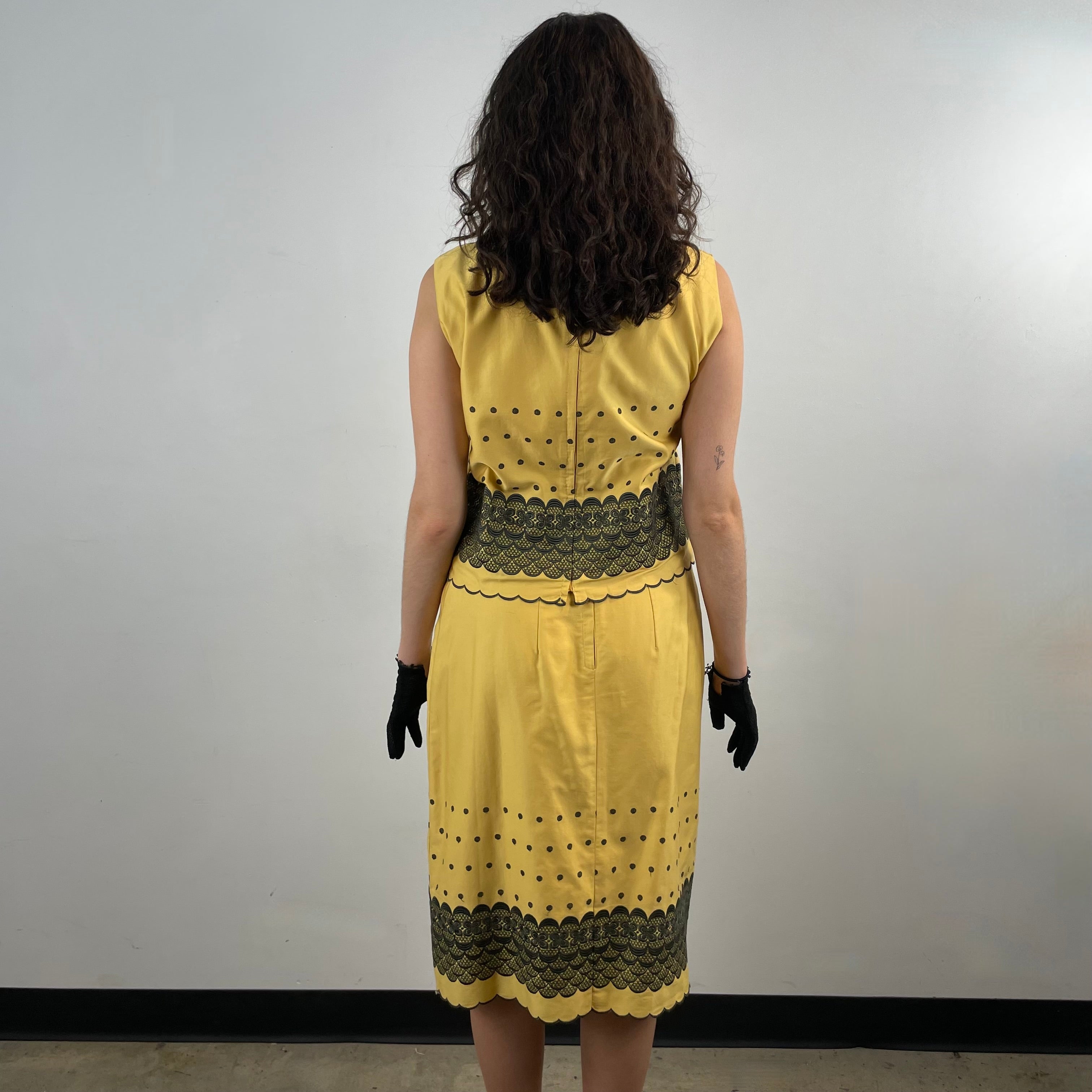Boheme Vintage 1960s handmade black and gold embroidered cotton skirt and top set with sleeveless top, straight skirt, and scalloped embroidered hems.