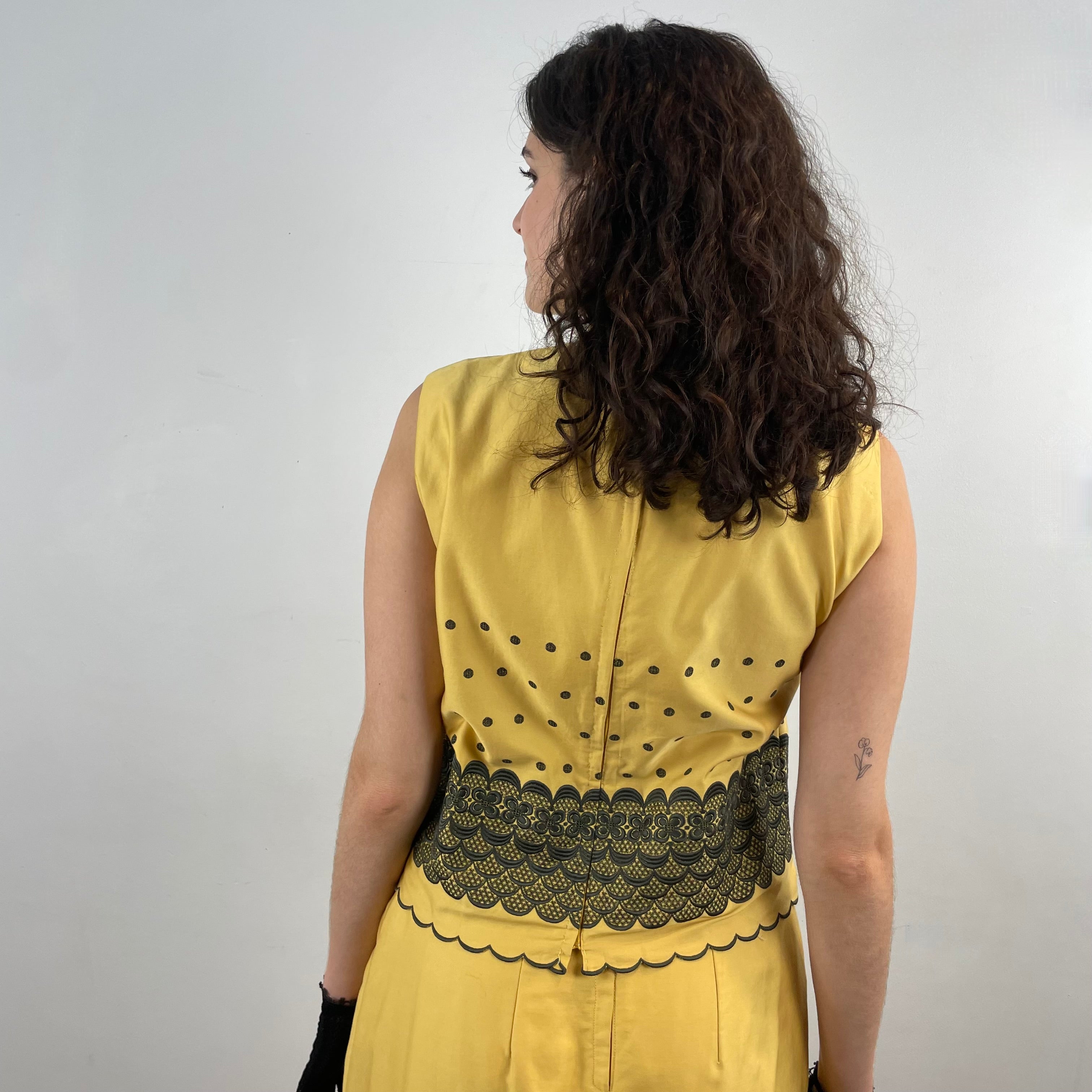Boheme Vintage 1960s handmade black and gold embroidered cotton skirt and top set with sleeveless top, straight skirt, and scalloped embroidered hems.