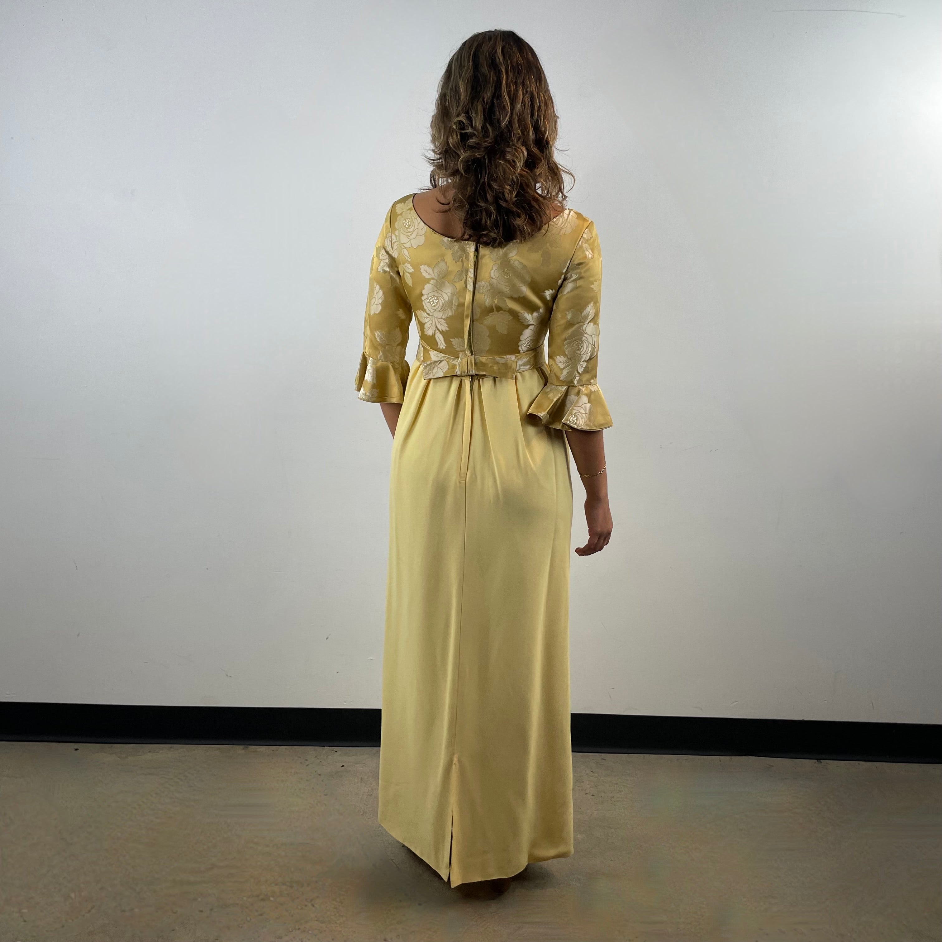 Boheme Vintage 1960s gold brocade and yellow crepe empire waist gown with flounce sleeves and flowing skirt.