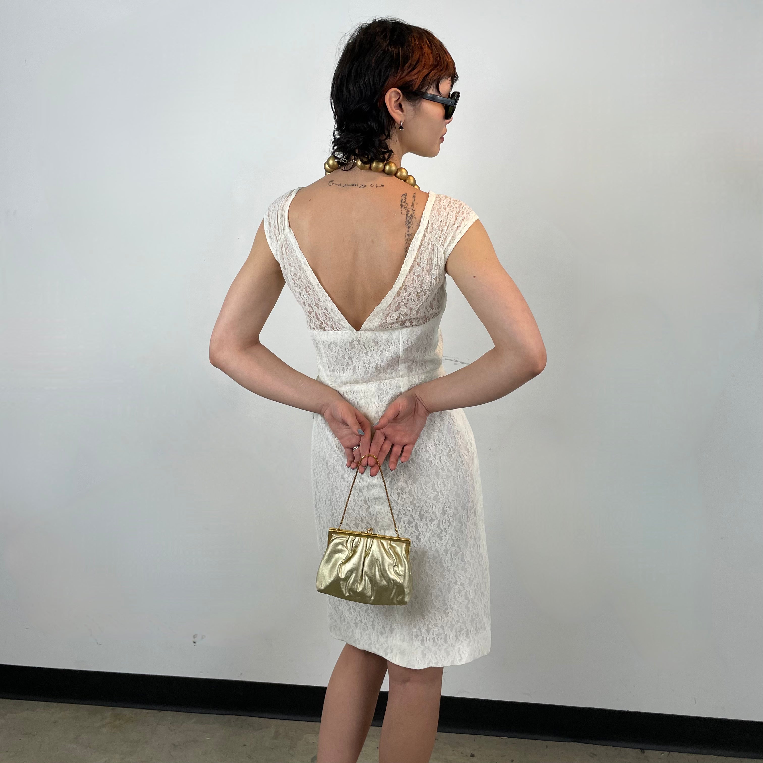 Back view of 1960s Ivory Lace Dress 
Size Small
Sold at bohemevintage.com 
Montréal 