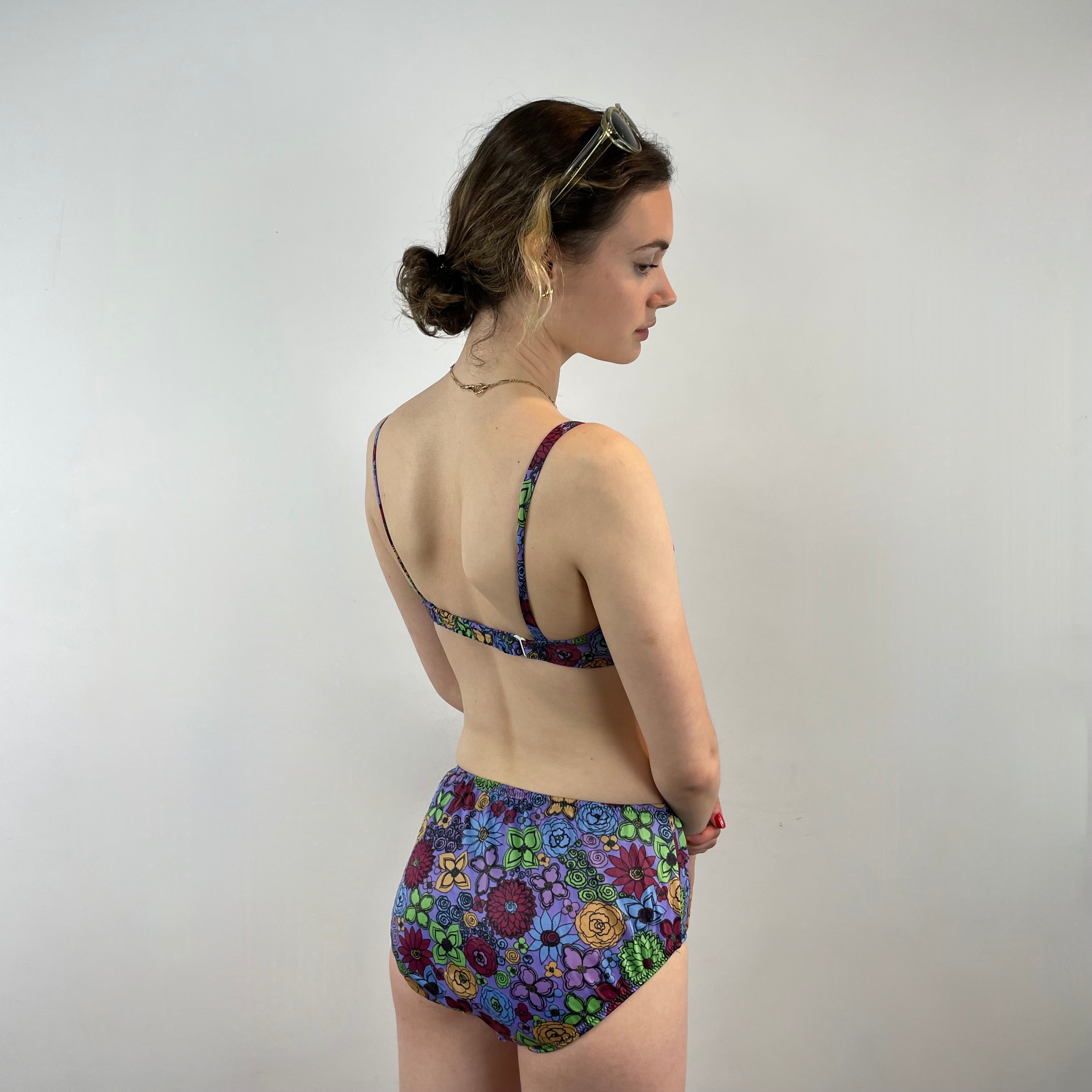 Boheme Vintage 1960s Smart Brassière floral two-piece swimsuit with underwire top, adjustable straps, and mid-rise bottoms.
