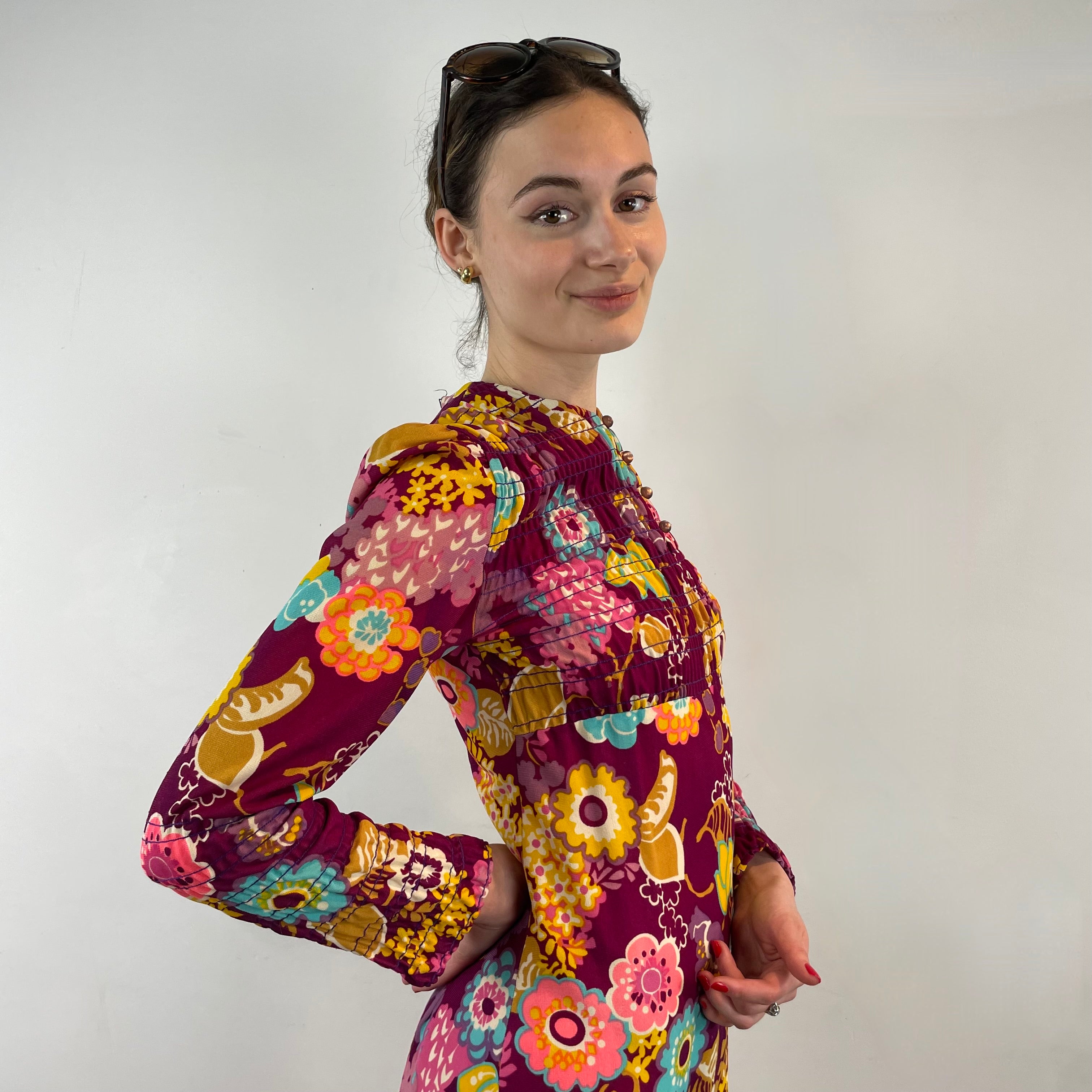 Side view of 1970s floral empire waist maxi dress with ruched bodice, high neckline and long ruched sleeves in bold print lightweight fabric – Boheme Vintage Montreal https://bohemevintage.com