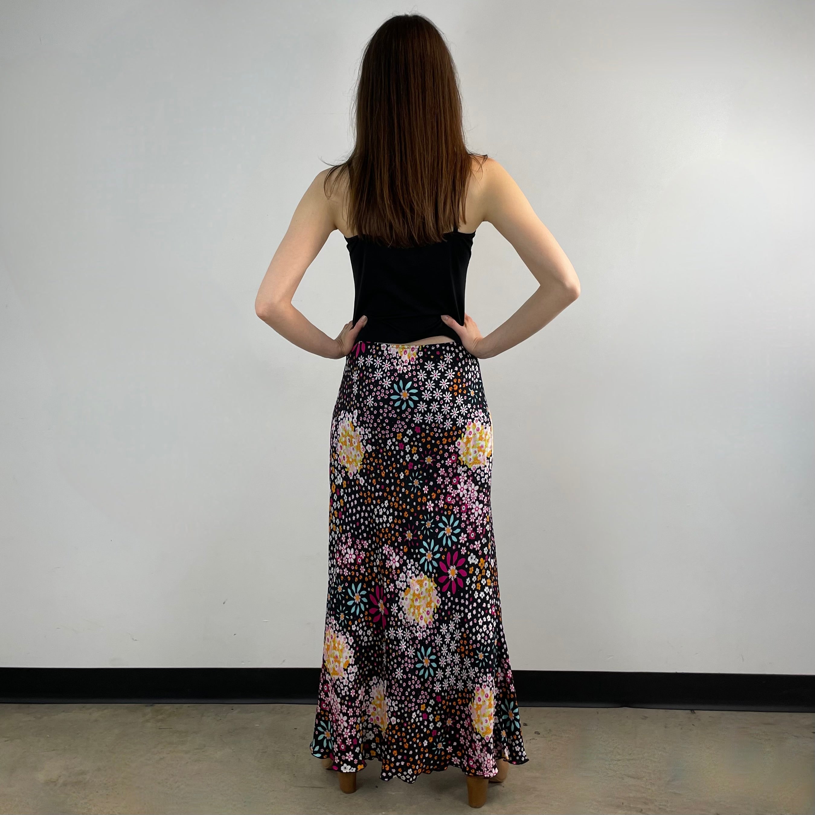 Vintage 1970s Ana Sanchez flared maxi skirt in dark colorful retro print, made from 100% viscose with an elastic waistband and knee-length lining.