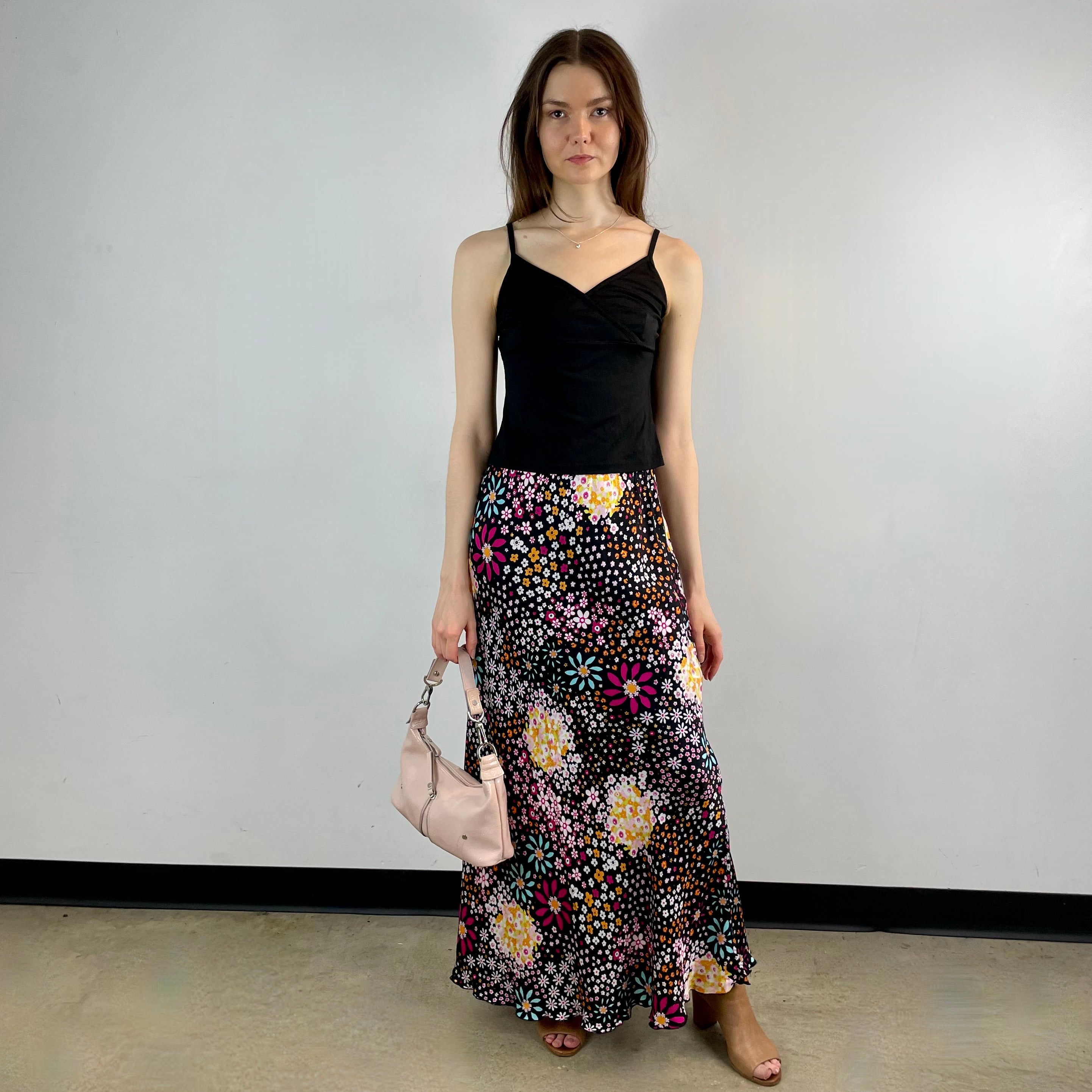 Vintage 1970s Ana Sanchez flared maxi skirt in dark colorful retro print, made from 100% viscose with an elastic waistband and knee-length lining.