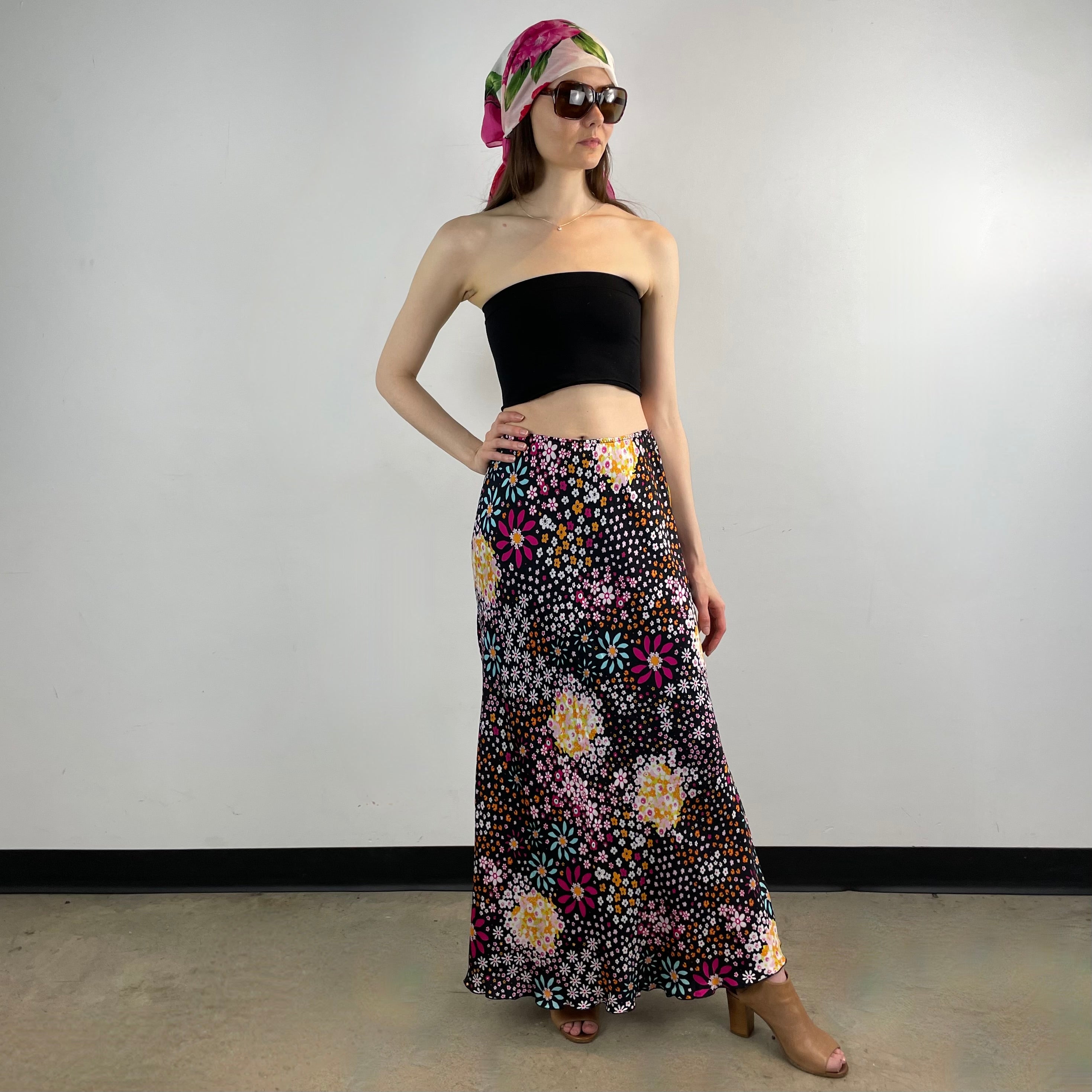 Vintage 1970s Ana Sanchez flared maxi skirt in dark colorful retro print, made from 100% viscose with an elastic waistband and knee-length lining.