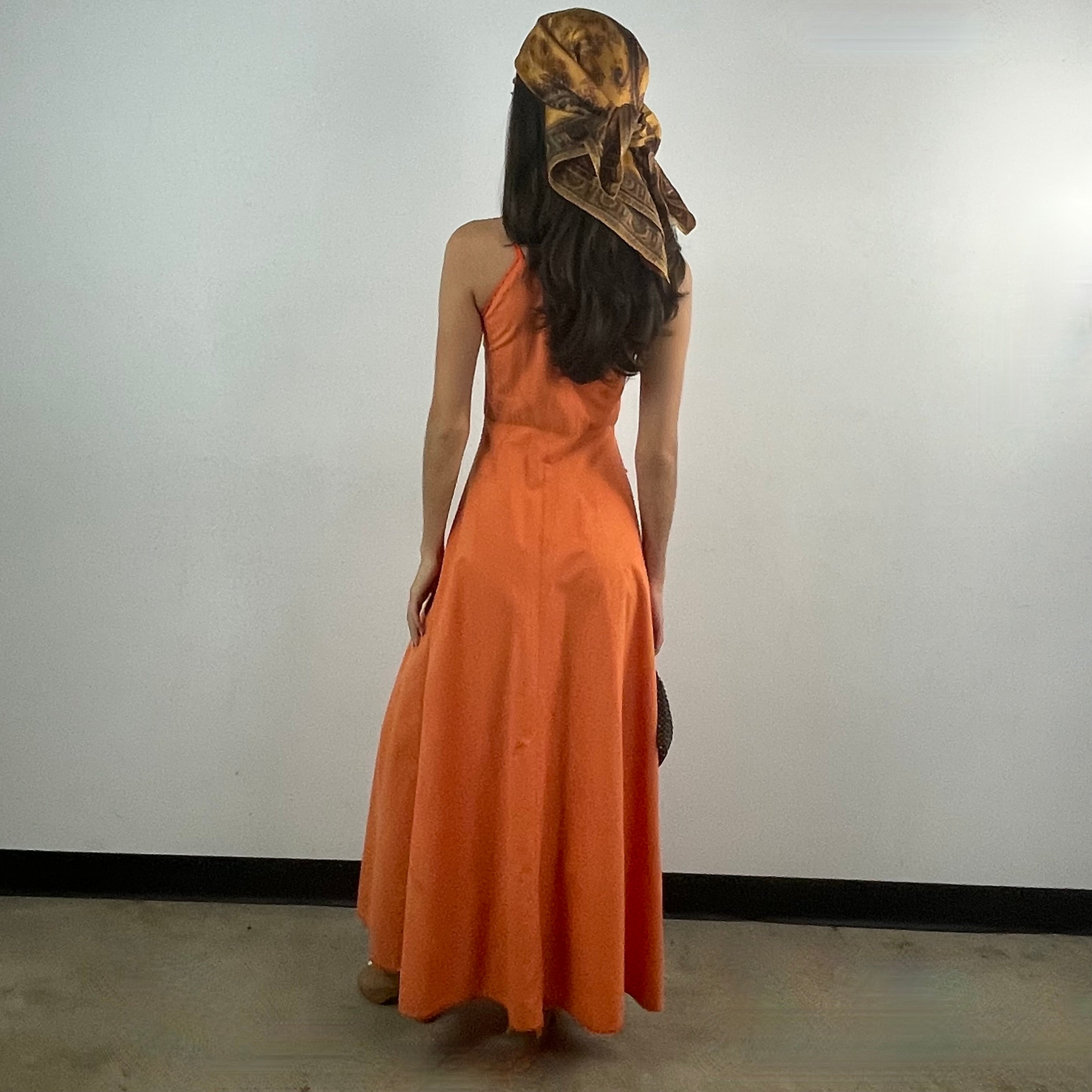 Boheme Vintage 1970s orange cotton empire waist maxi dress with crochet trim, front buttons, flared skirt, and patch pocket.