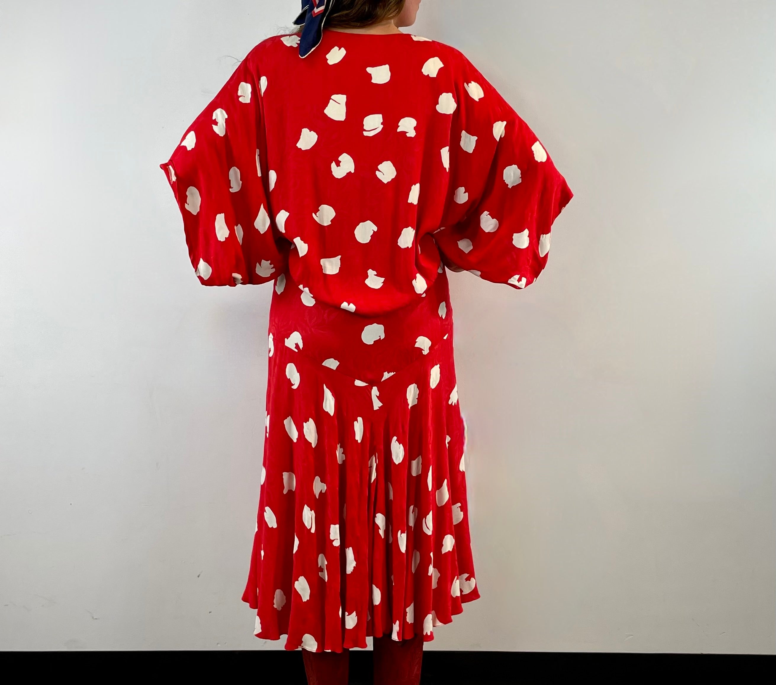 Boheme Vintage 1980s Jackie Bernard for EKLEKTIC red and white viscose kimono-style midi wrap dress with dolman sleeves and pleated skirt.