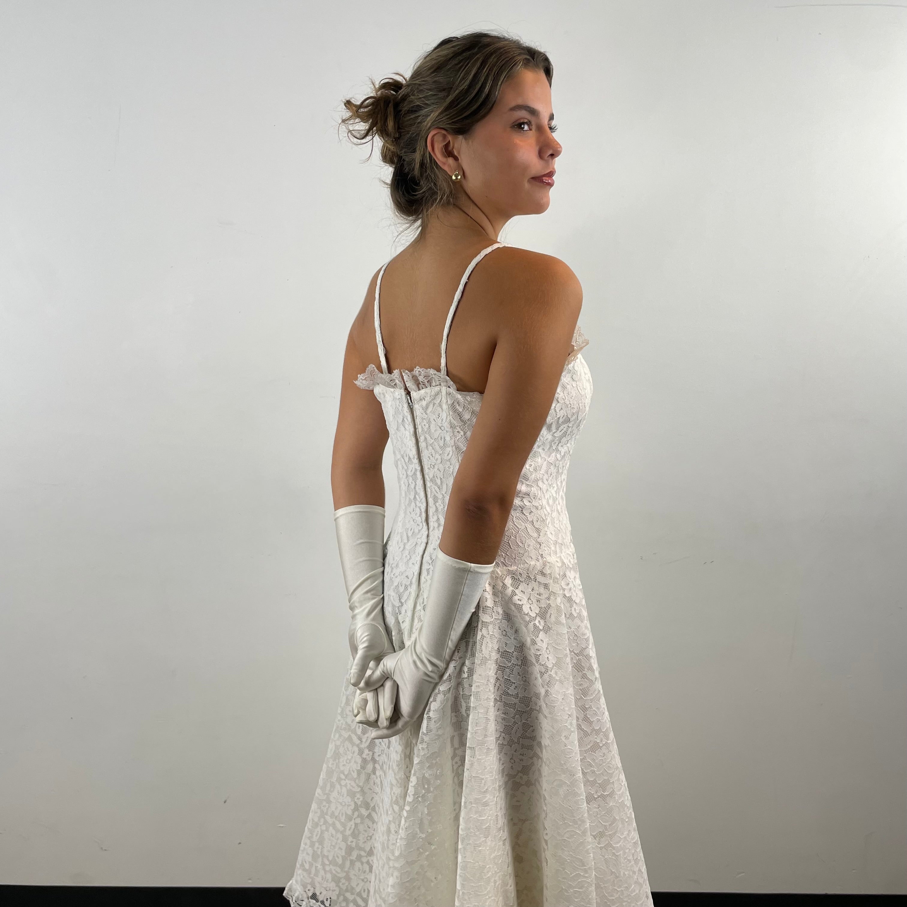 Boheme Vintage 1990s Algo Boutique white lace bustier dress with narrow straps, flared skirt, and layered tulle hem.